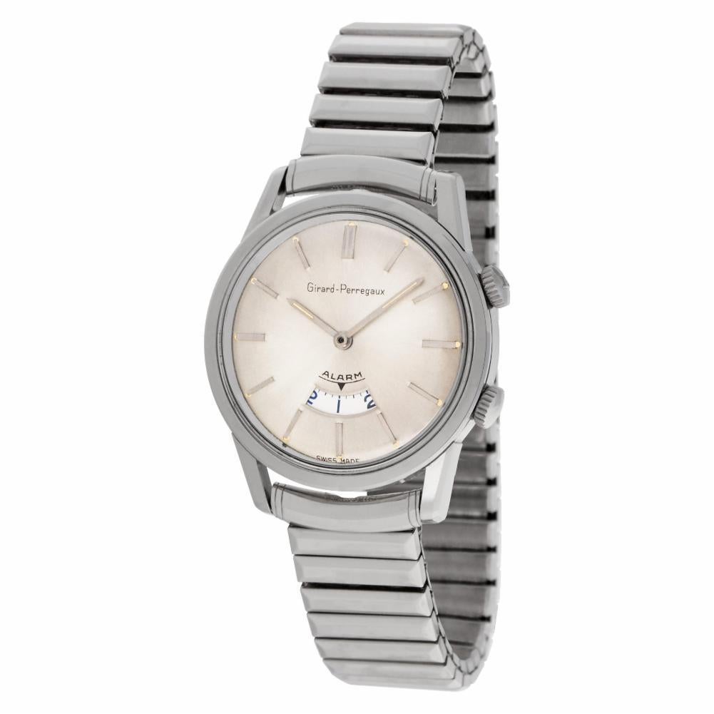Vintage Gents Girard-Perregaux Alarm wristwatch in stainless steel on bracelet. With two winding crowns. Manual w/ alarm. 35 mm case size. Circa 1960s. Fine Pre-owned Girard Perregaux Watch. Certified preowned Vintage Girard Perregaux Alarm 1475