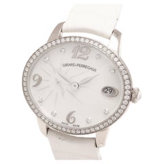 Girard Perregaux Montre oeil de chat automatique en or blanc 18 carats et diamants