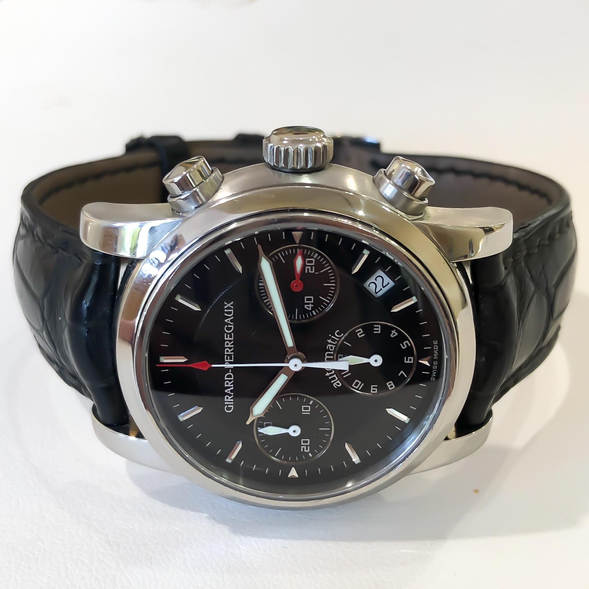 Men's Girard Perregaux Chronograph Sport Classique Steel Automatic Black Watch

•MODEL: SPORT CLASSIQUE
•REFERENCE NO: 8021 AN 27
•MOVEMENT: MECHANICAL AUTOMATIC SELF WINDING
•CASE MATERIAL: STAINLESS STEEL
•CONDITION: LIKE NEW EXCELLENT PRE-OWNED