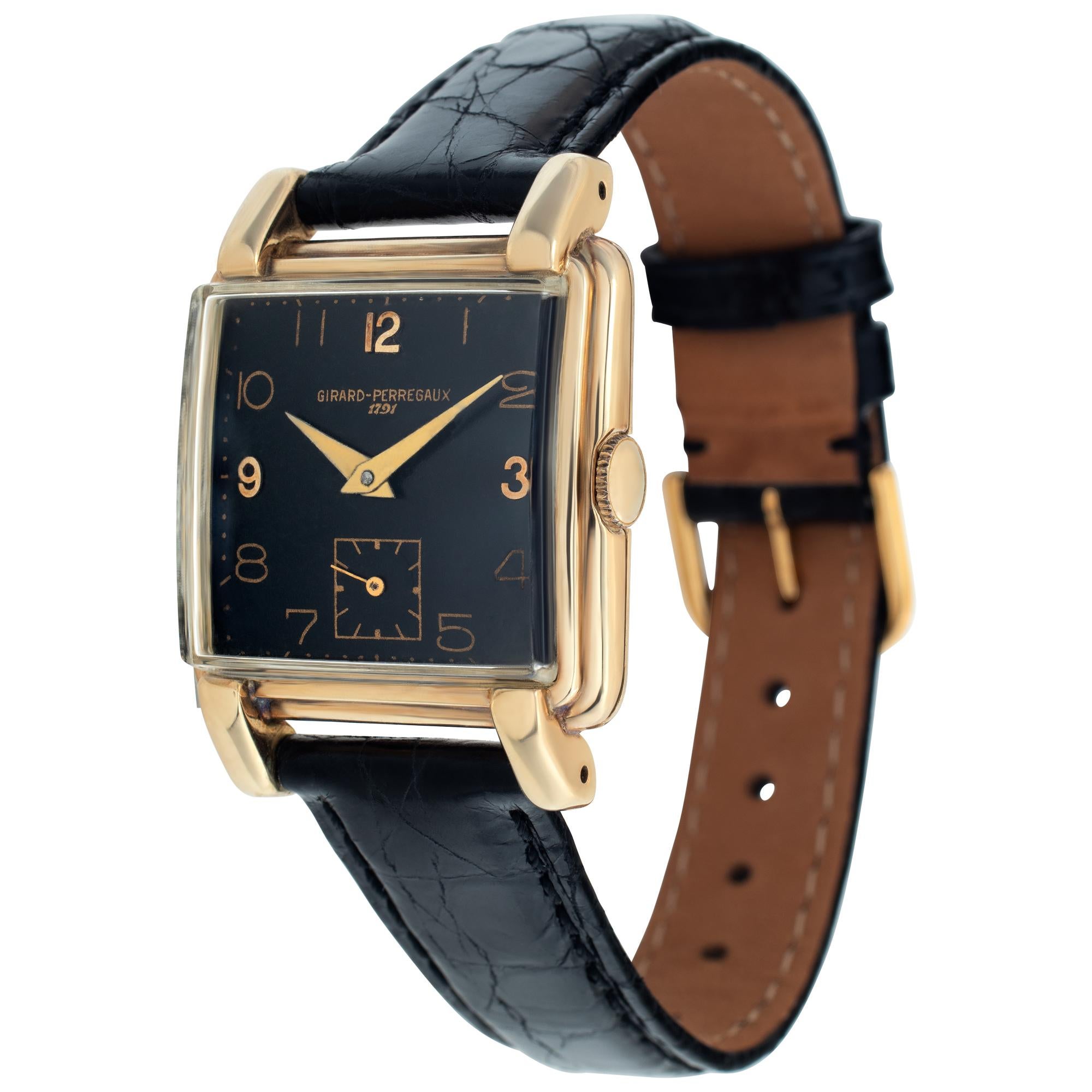 Vintage Girard Perregaux in 14k yellow gold with black dial on black crocodile strap. Square case with lobed lugs. Manual wind with sub-seconds. 28 mm case size. Circa 1950s. Fine Pre-owned Girard Perregaux Watch. Certified preowned Vintage Girard