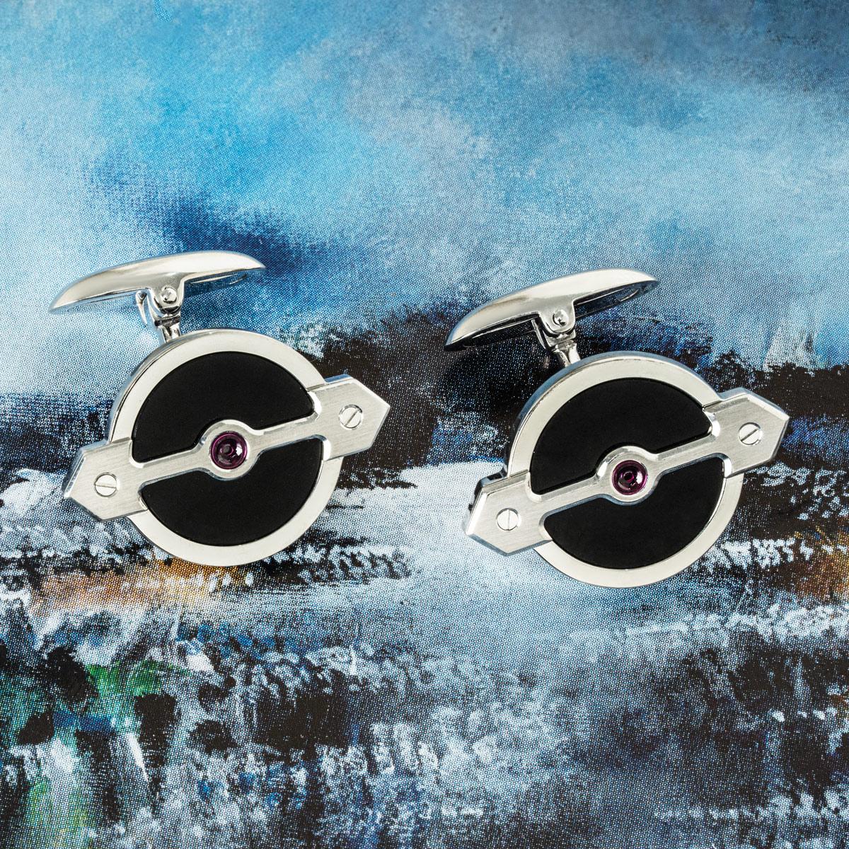 A pair of Golden Bridge cufflinks by Girard Perregaux in white gold. Each cufflink features a Golden Bridge style motif set with a single ruby and surrounded by onyx. Featuring whale back fittings, the cufflinks measure 22.5mm in diameter. The