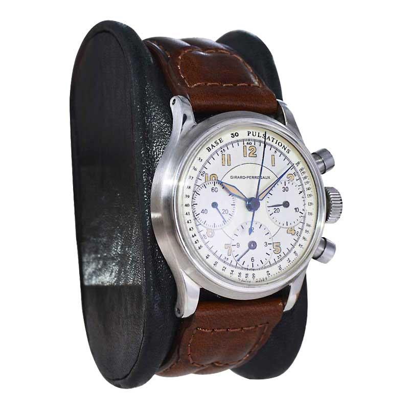 FACTORY / HOUSE: Girard Perregaux Watch Company
STYLE / REFERENCE: Chronograph / Reference 22209
METAL / MATERIAL: Stainless Steel 
CIRCA / YEAR: 1950's
DIMENSIONS / SIZE: Length 39mm X Diameter 33mm
MOVEMENT / CALIBER: Manual Winding / 17 Jewels