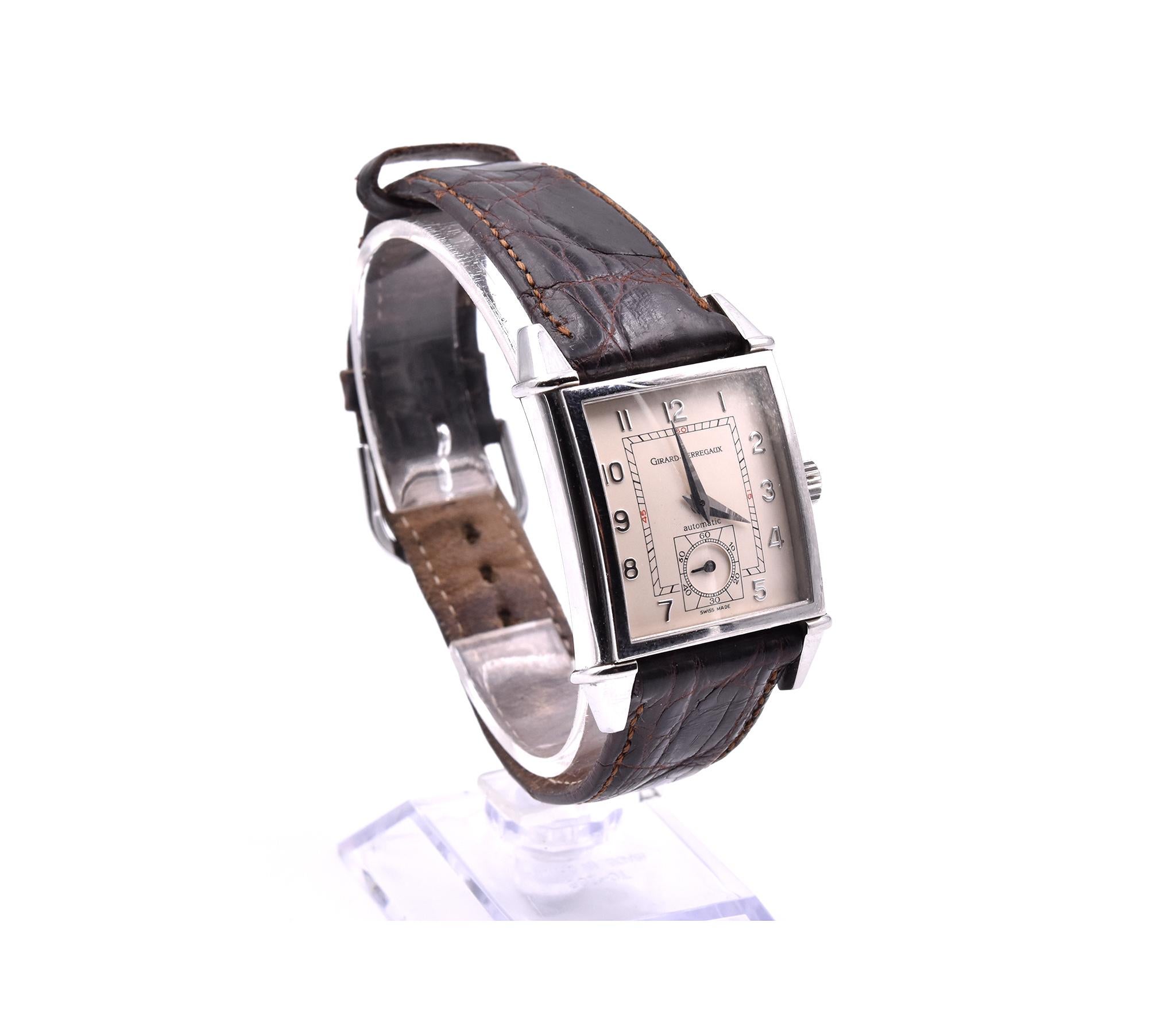Movement: winding crown
Function: hours, minutes, small seconds
Case: rectangular 28mm x 42mm (including lugs) stainless steel case with sapphire crystal, see-through back
Band: brown alligator leather strap with stainless steel tang buckle
Dial: