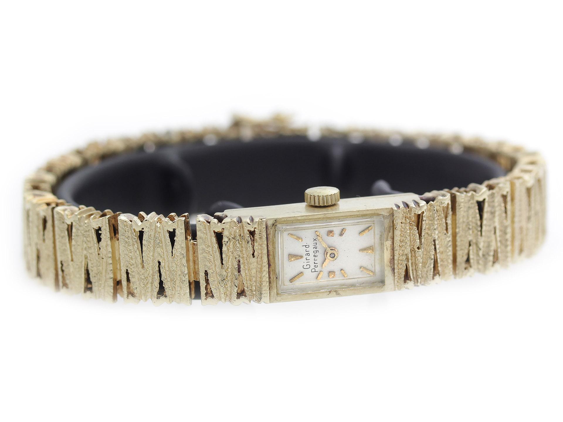 Girard Perregaux Vintage 14K watch, with solid 14K yellow gold case & jewelry bangle.

Watch	
Brand:	Girard Perregaux
Series:	Vintage 14K
Model #:	N/A
Gender:	Ladies
Condition:	Good Pre-owned, Discoloration to Gold, Scratches on Crystal, Not Water
