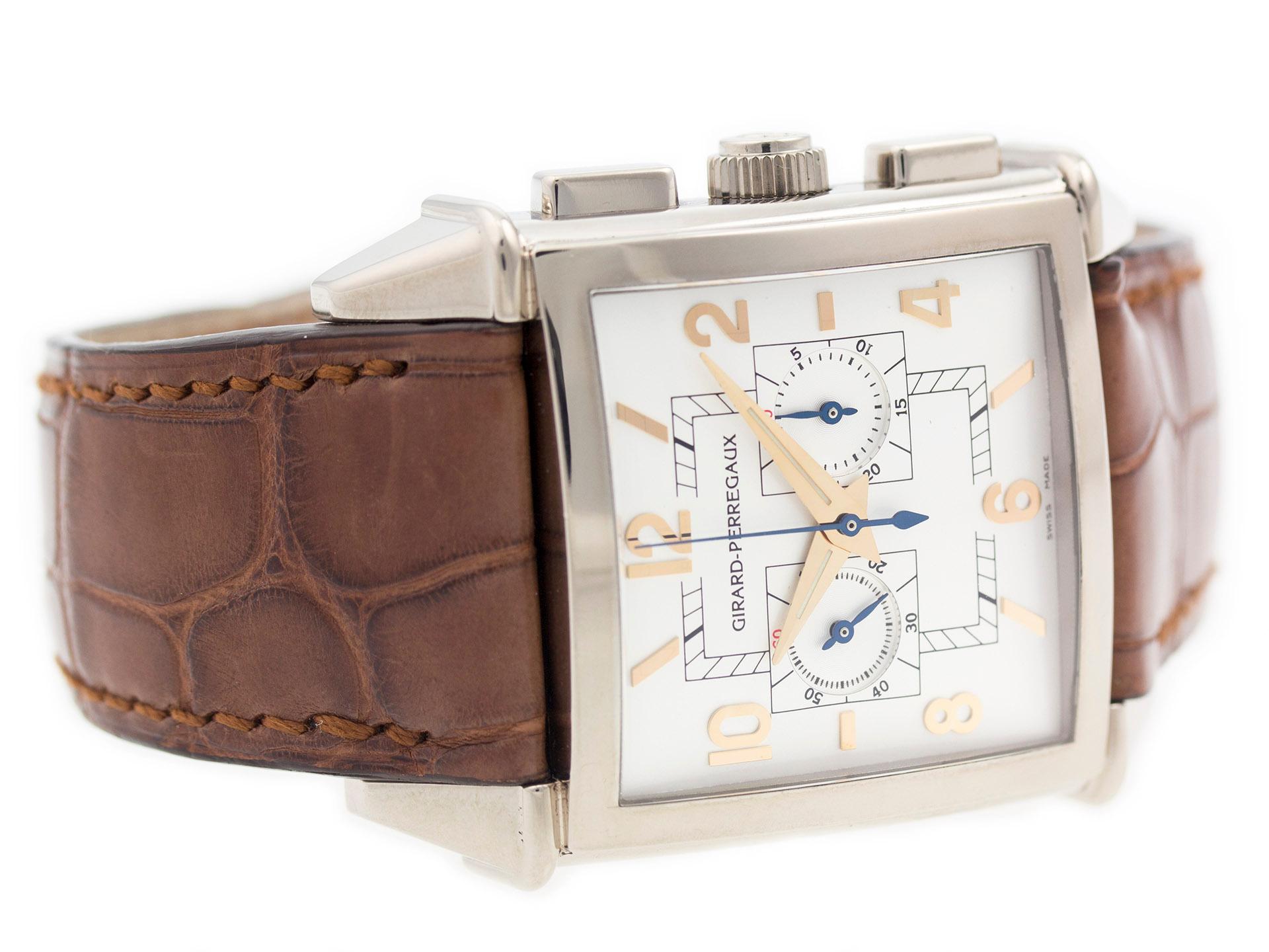 18K White Gold Girard Perregaux Vintage 1945 25820-53-151 watch, water resistance to 30m, with chronograph and leather strap.

Watch	
Brand:	Girard Perregaux
Series:	Vintage 1945
Model #:	25820-53-151
Gender:	Mens
Condition:	Excellent Display Model,
