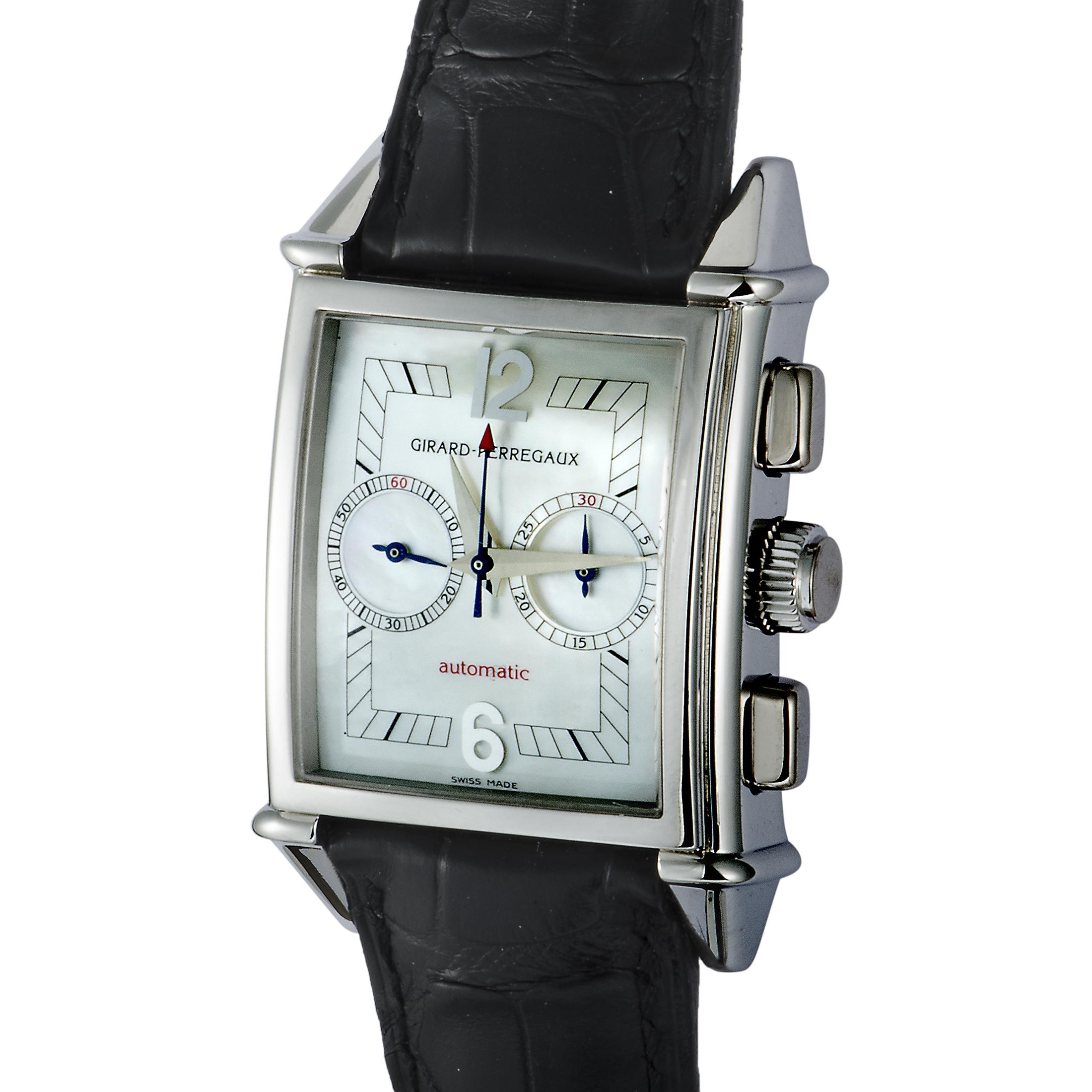 This splendid mint condition timepiece from Girard-Perregaux, circa 200's, offers an elaborate chronograph function presented on the beautiful white mother-of-pearl dial with blue makers and Arabic numerals. The watch is powered by a self-winding