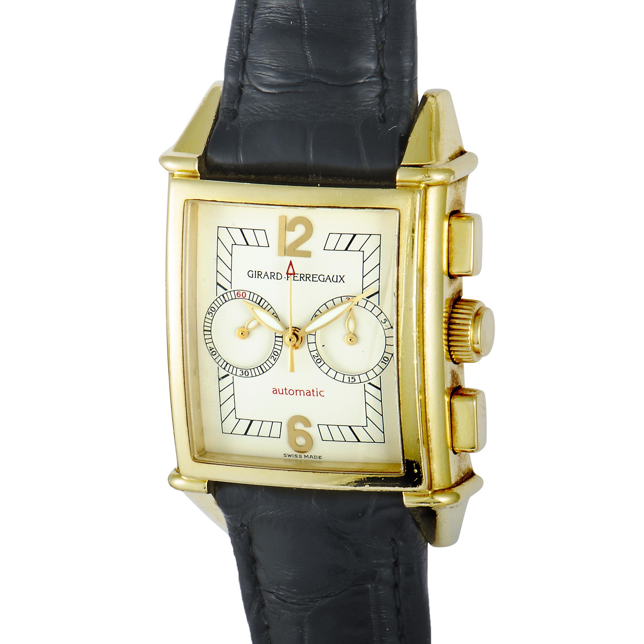 This magnificent timepiece from Girard-Perregaux, circa 2000's, features a chronograph with a beautiful silvered guilloche dial, yellow gold markers, and Arabic numerals. The case of the watch is made of 18K yellow gold and it is presented on a