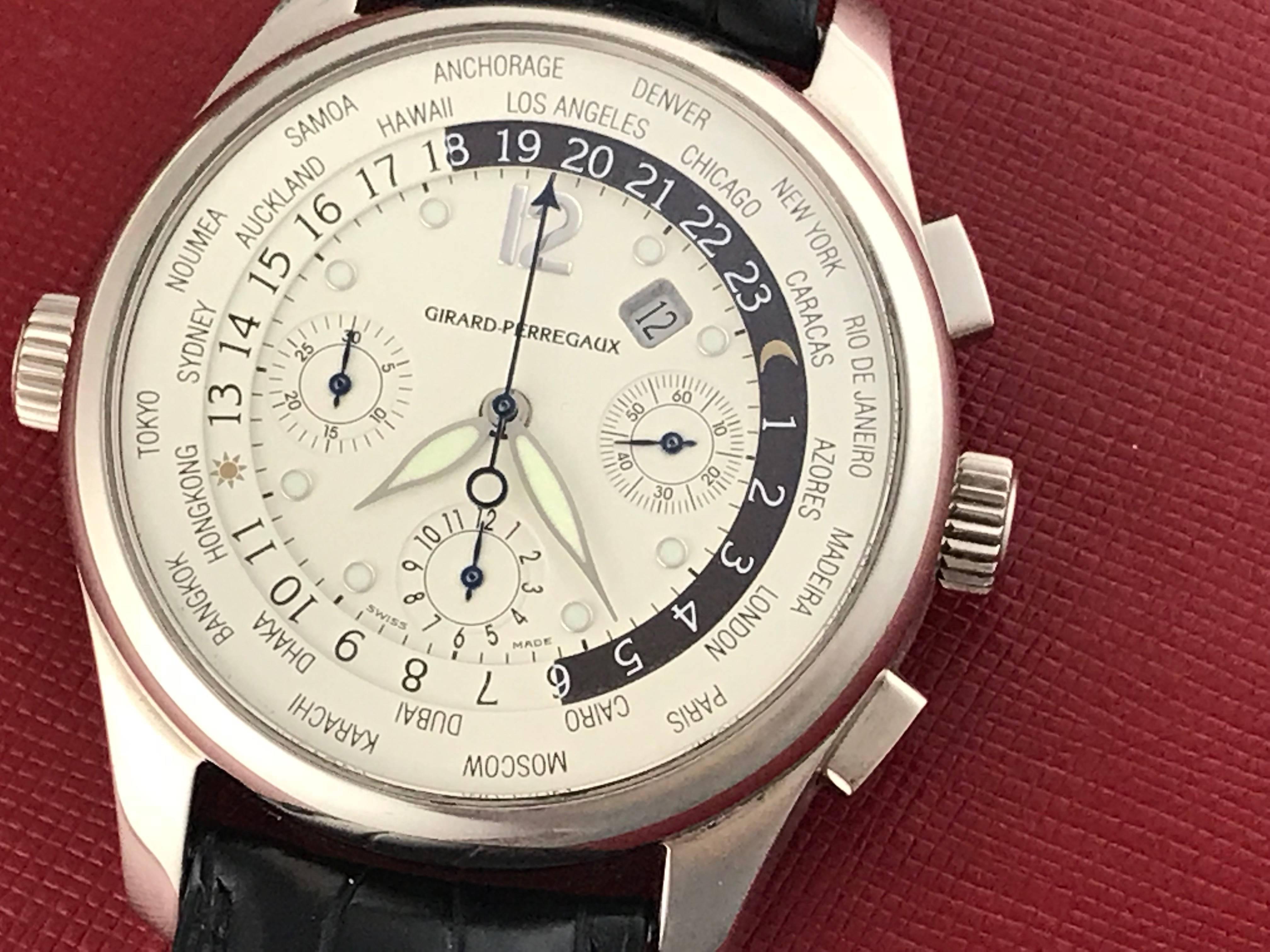 Girard Perregaux World Time Model 49805.53.151 Pre Owned Mens Automatic World Time Chronograph and GMT Men's wrist watch. Off-White Dial with cities of the world around outside edge and luminous hands and hour markers. Heavy 18k White Gold case with