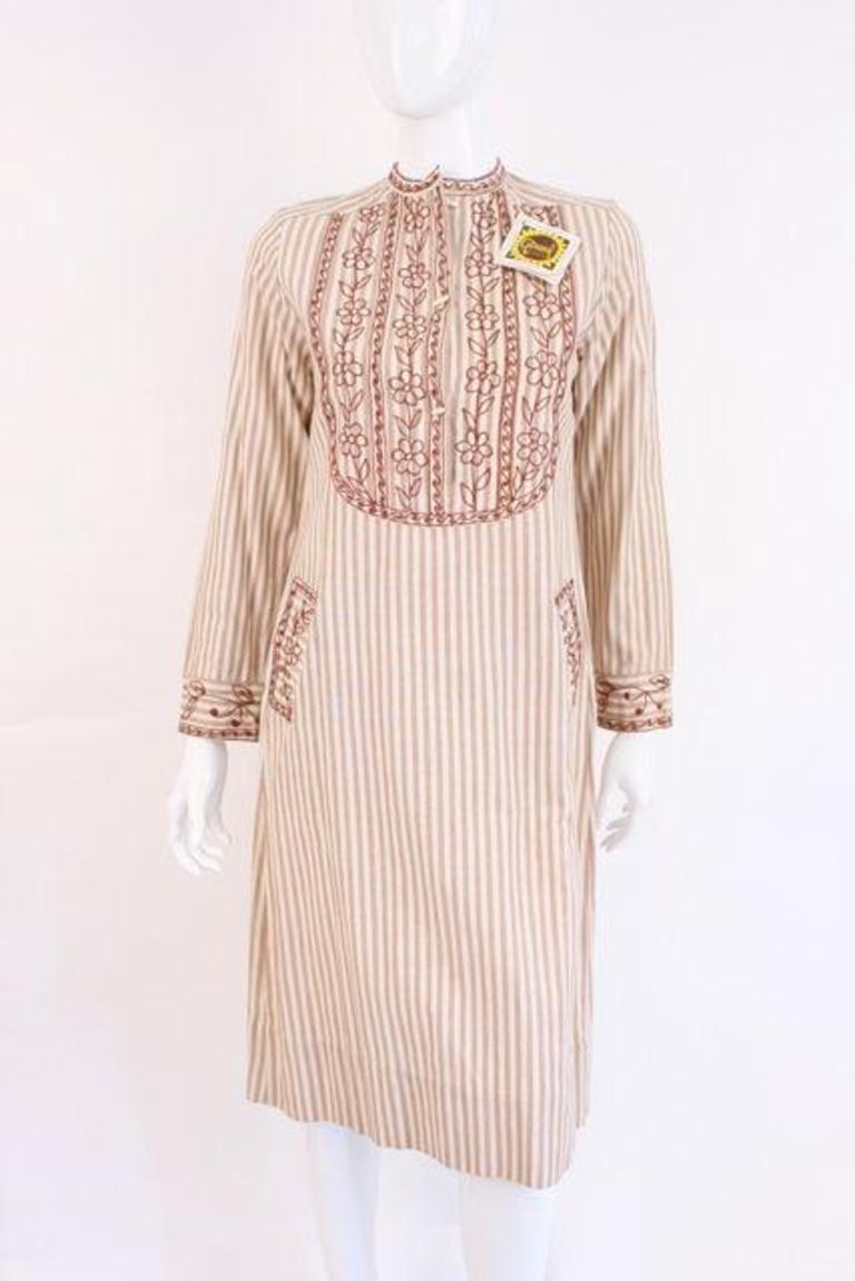 Deadstock Vintage 70's GIRASOL Striped Cotton Mexican Dress.  This dress is deadstock (new with tags) and so cute!

 Designer: Girasol

Condition:  Excellent

Size:  fits like a small-medium

Length:  24  inches long 

Bust: 19 inches across the