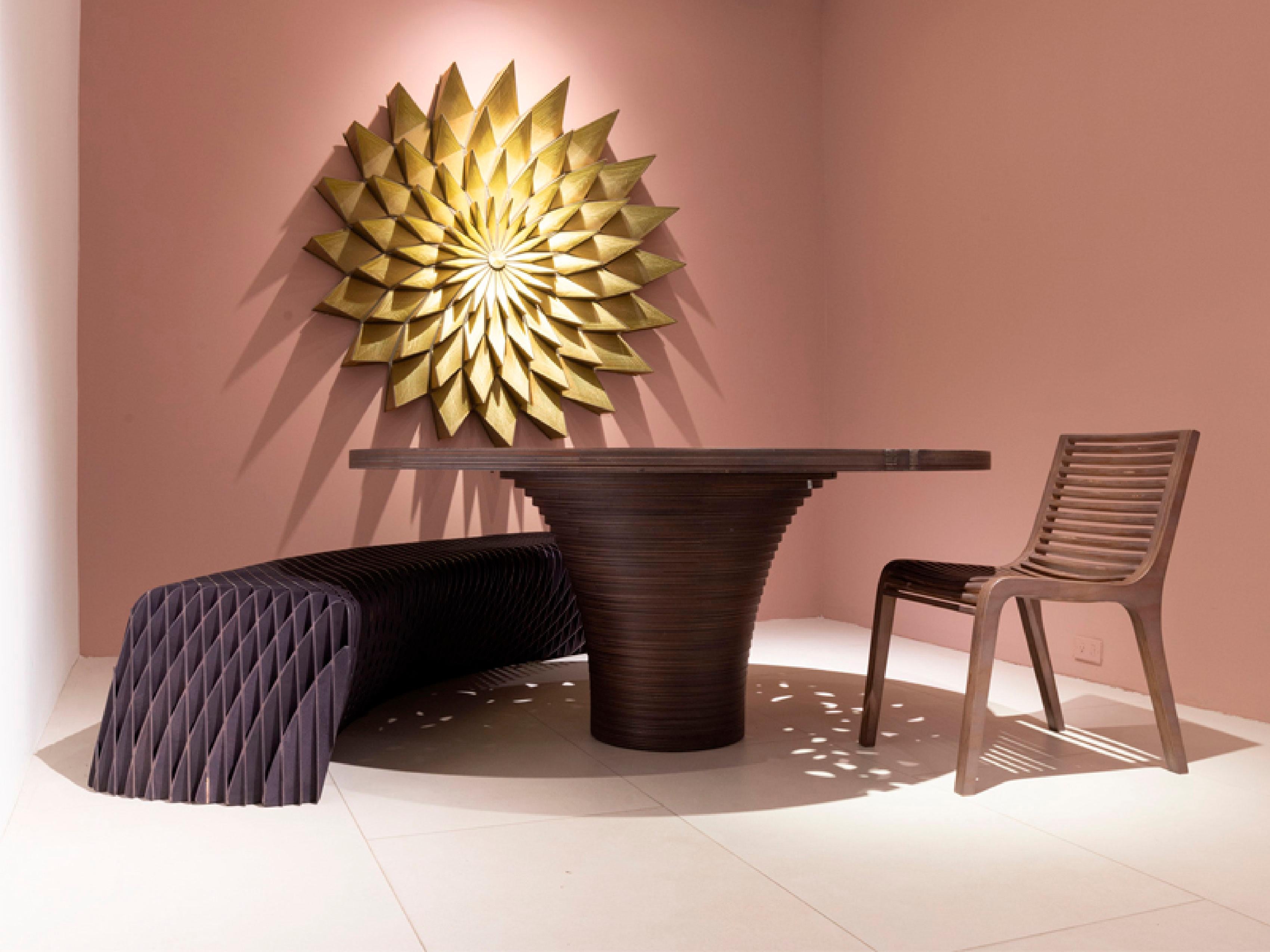 This stunning wall decoration, titled Girasol, is a vibrant and intricate piece that brings warmth and beauty to any space. Crafted with a blend of silk, cotton, synthetic threads, and PVC, it combines luxurious texture and durability. The silk and