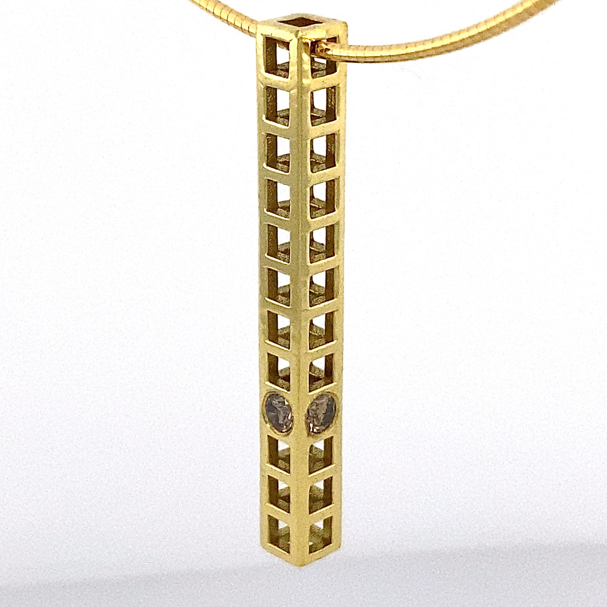 This is a one-of-a-kind necklace by Eytan Brandes featuring a modern, architectural pendant in polished 18 karat yellow gold.  Four light brown, full-cut diamonds are set at the same position on each side.  

The 14 karat gold choker-length round