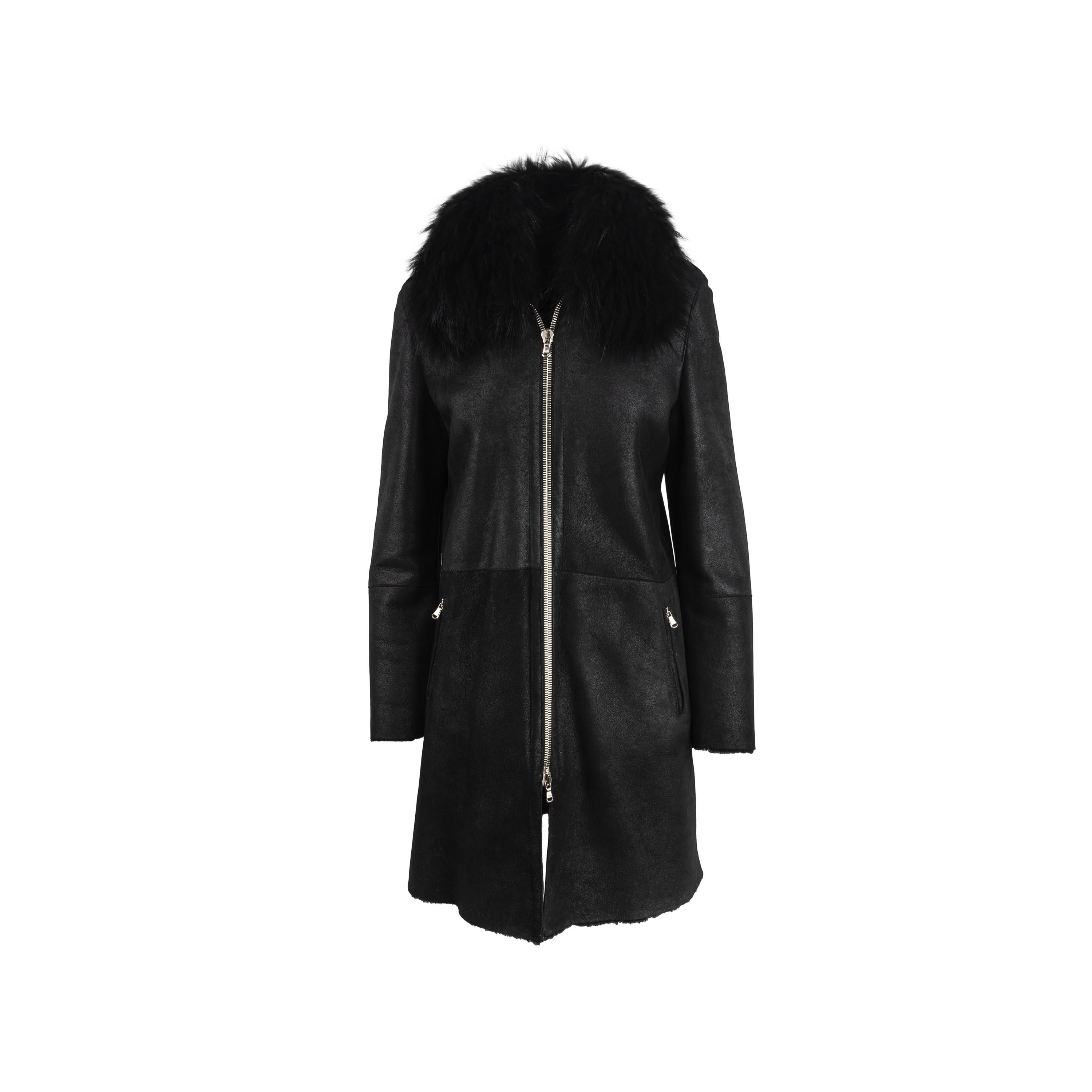 Girgio Brato black shearling coat. Long style, central zip fastening, fox fur collar.