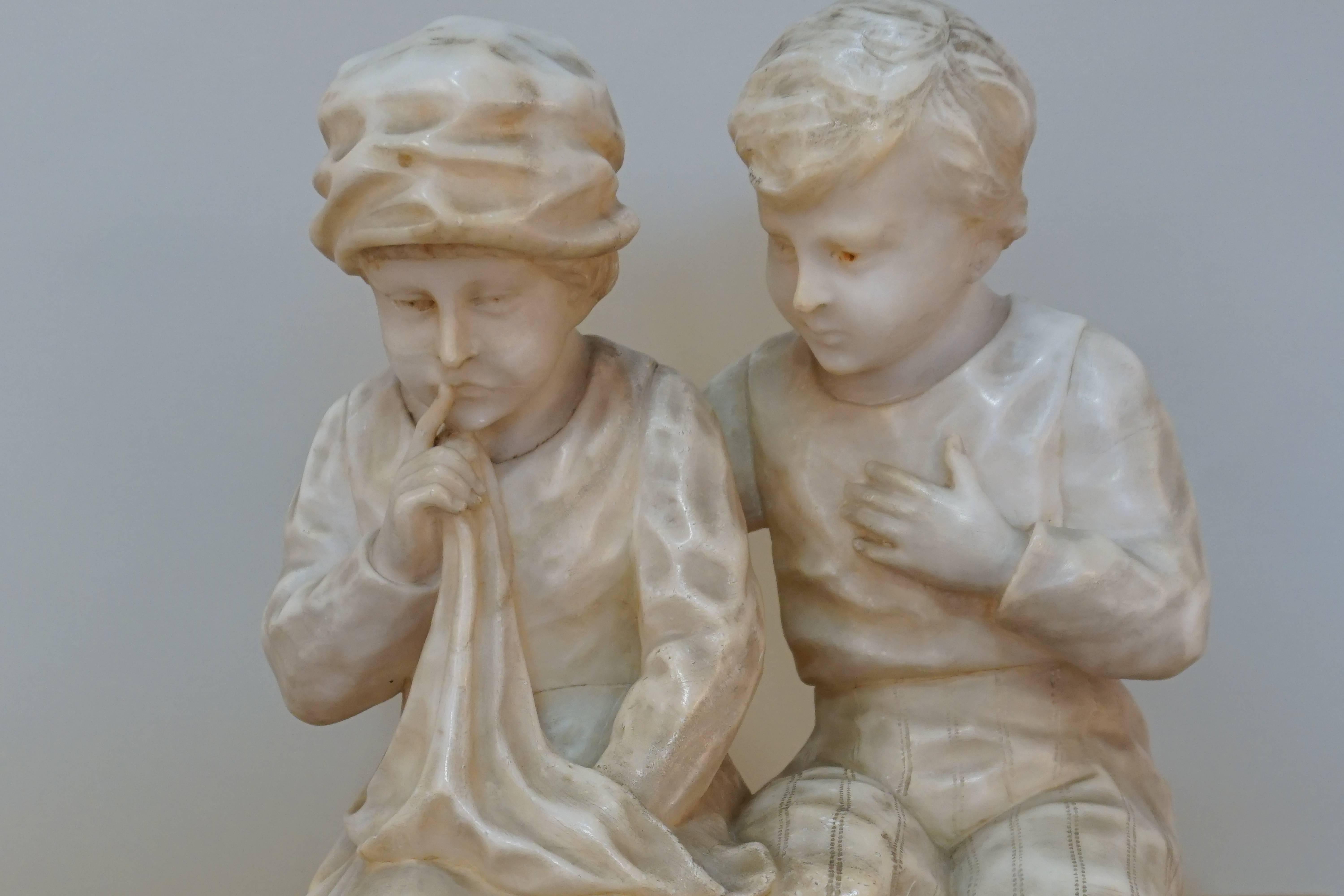 A Dutch style a boy and girl sitting on a bench. Hand-carved marble sculpture.