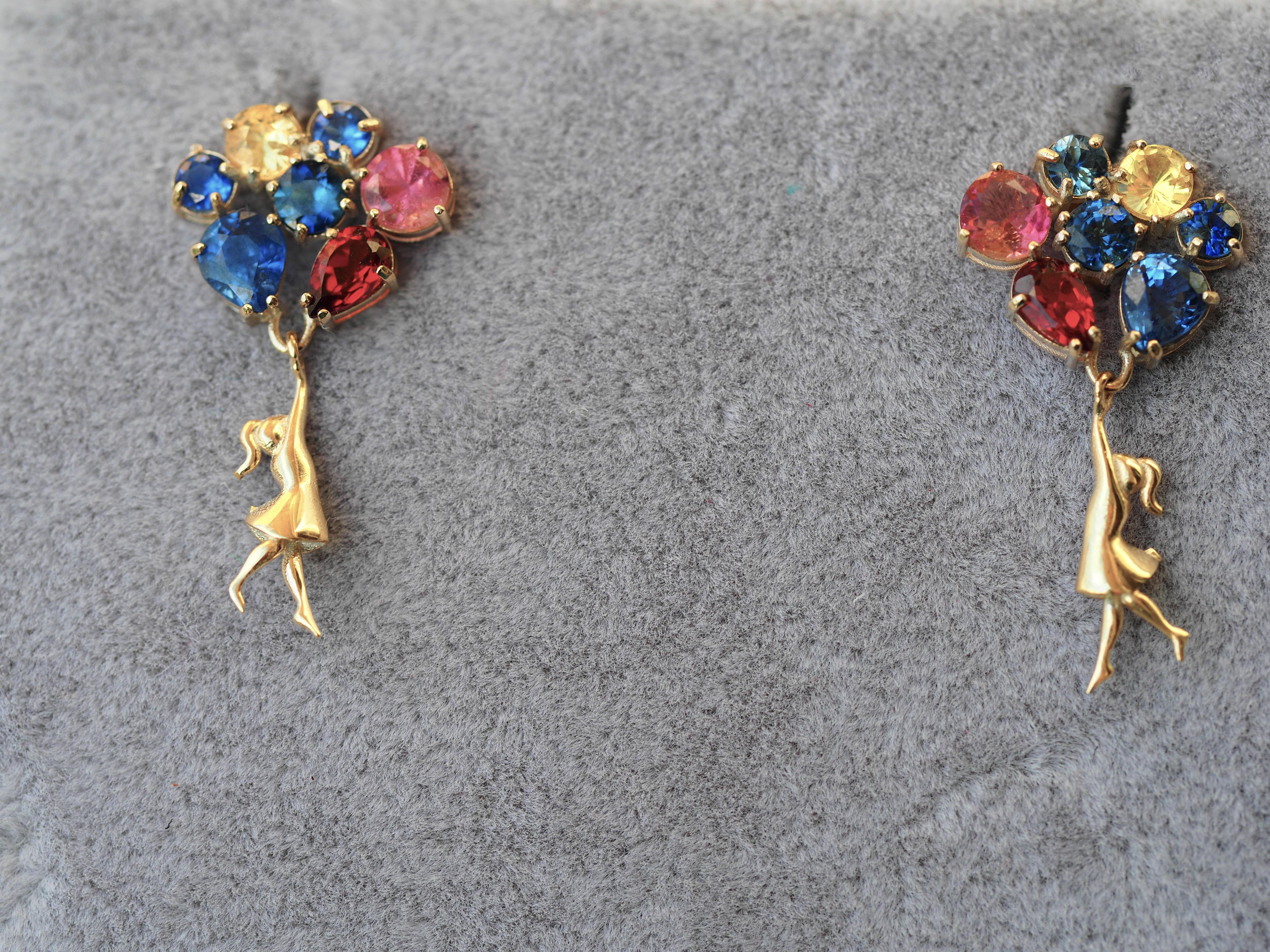 Banksy inspired Girl on balloons earrings with multicolor natural gemstones. Contemporary design earrings.
14k gold
Weight: 3.20 g.
Size: 25 х 7 mm.

Gemstones:
Blue sapphires: 2 pieces, 5 x 4 mm each - 1.20 ct total weight, blue violet color, pear