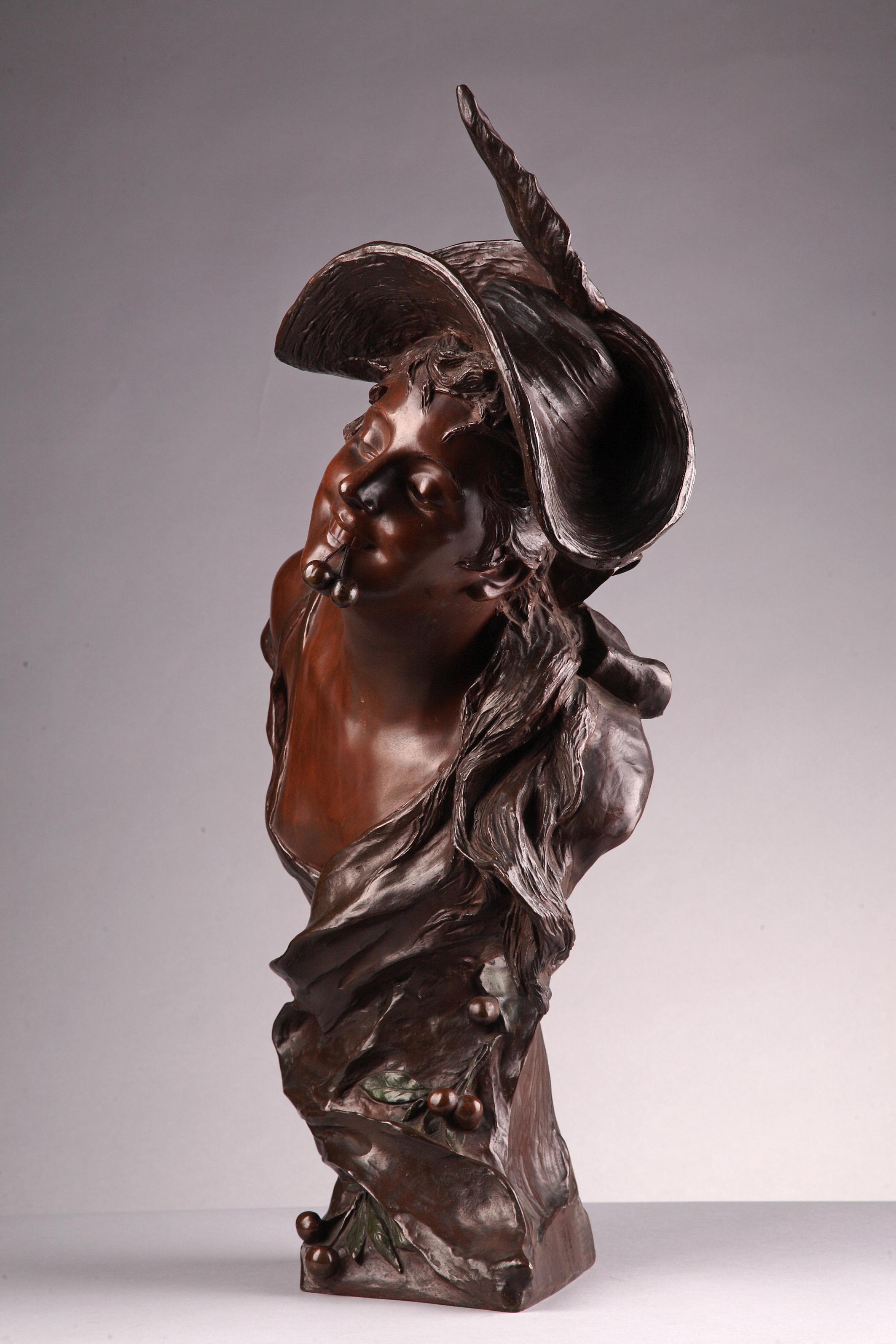 Signed Van der Straeten and Société des bronzes de Paris.

Bronze bust by Van der Straeten with a brown patina, the bronze base draped with the girl’s clothes and ornamented with cherries, with their original polychrome patina. 
Bust listed in