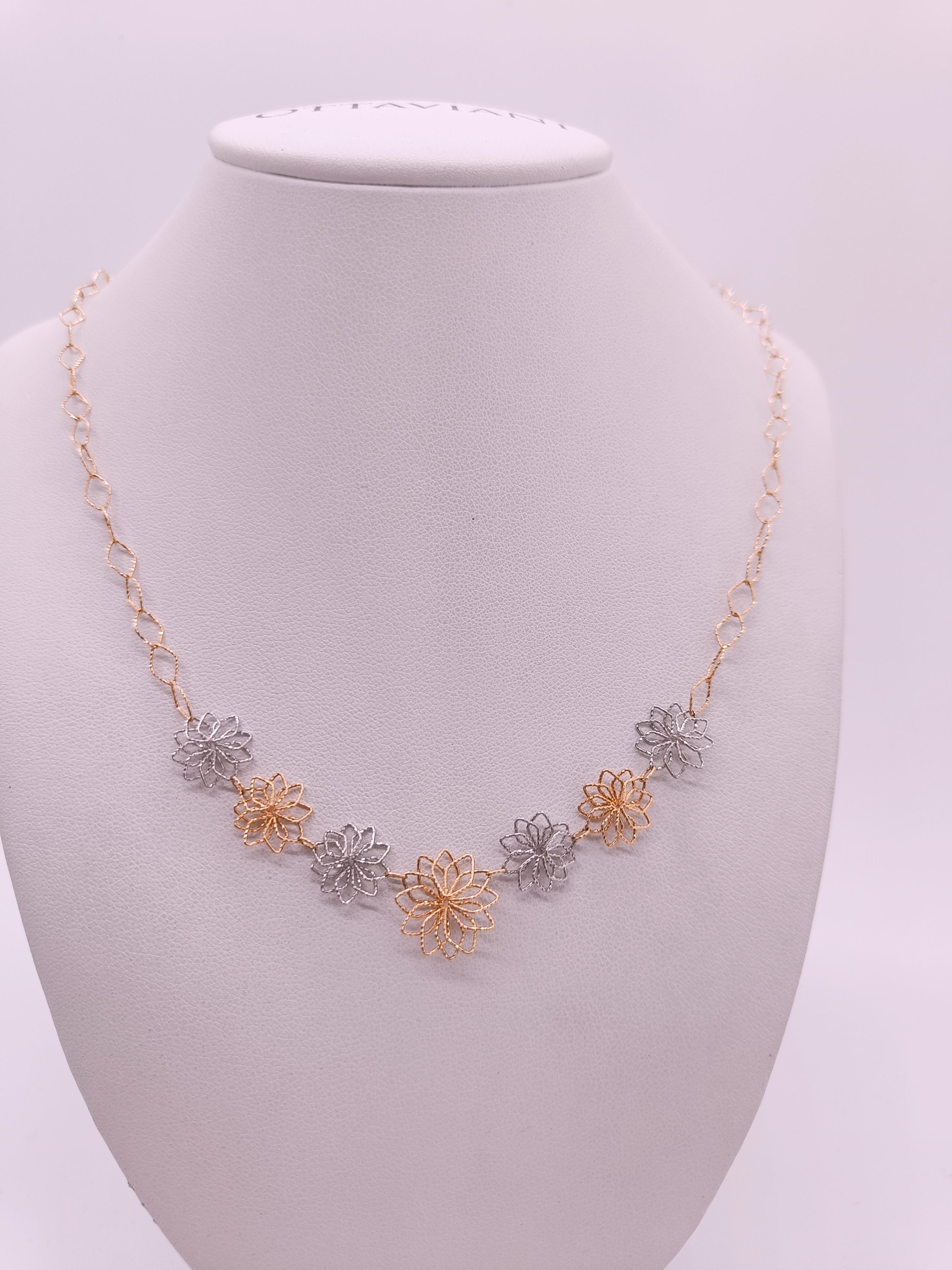 18k Gold mixed yellow and white choker necklace with flower-shaped links chained together.

The special feature of this model is the ability to unhook or add the pendant via a convenient clasp that is imperceptible to the eye.
But among its features