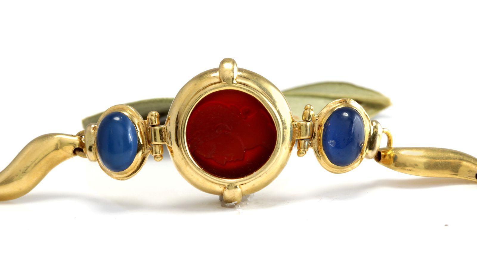 GIROVI Very Impressive Cameo Carnelian Inlay and Sapphire 18K Solid Yellow Gold Designer Bracelet 

Suggested Replacement Value: $9,800.00

STAMPED: 750 (18K)

Two Natural Cabochon Sapphires: 8.76 x 6.40mm

Natural Red Cameo Carnelian Size: