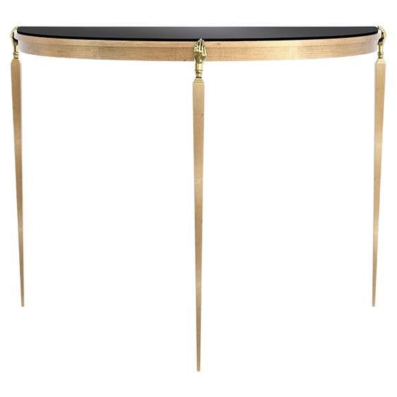 Slender elegance radiates from the Gisele Demi-Lune Console. Delicate brass hands set upon three perfectly appointed legs hold up the piece’s crescent-shaped top. Offering a perfect entry statement, hallway accent or living room side table,