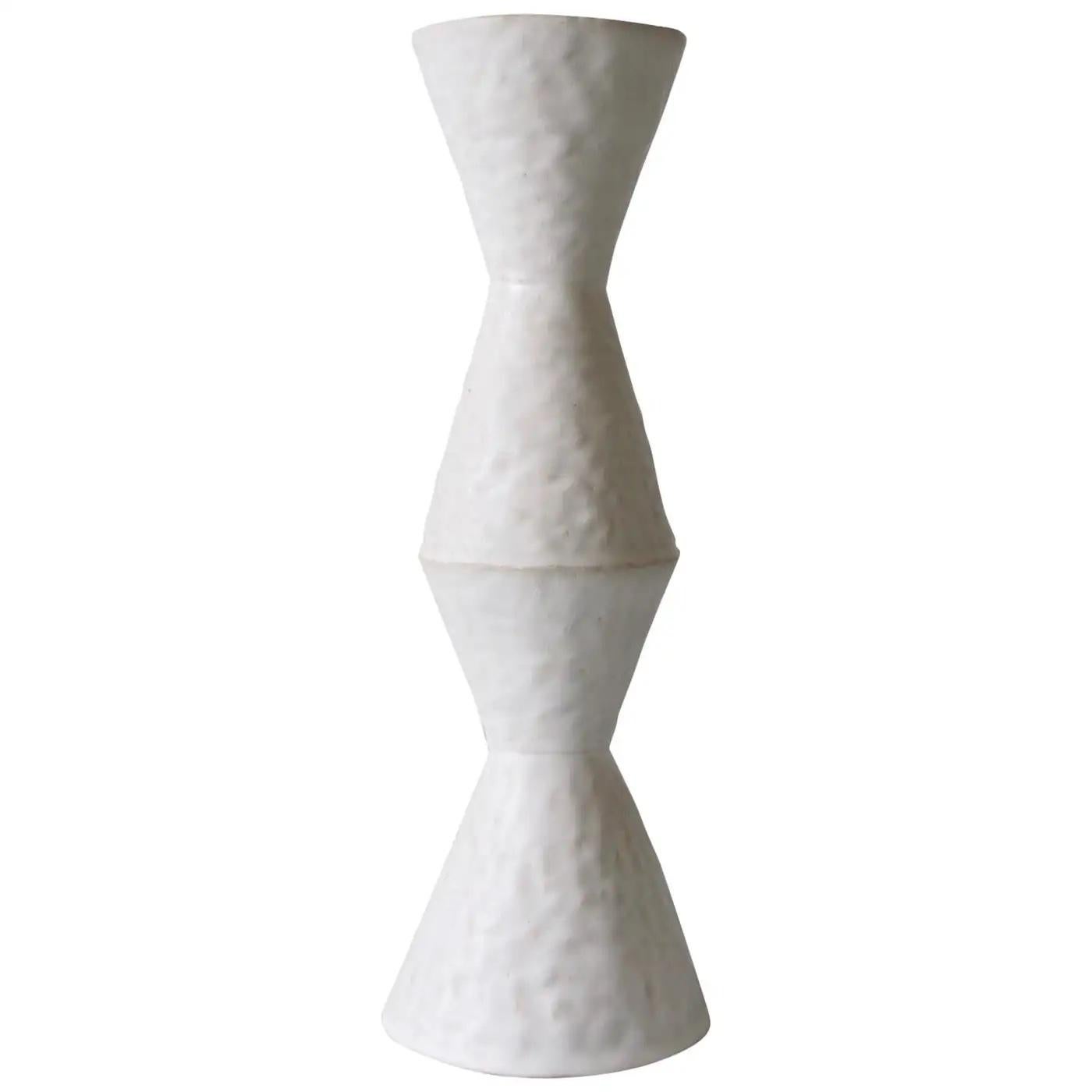 Contemporary American ceramic artist Giselle Hicks' glazed white stoneware vase is part of her Vessel Series. Each form is built by hand using a coil and pinch technique. They are formal explorations in shape, volume, color and composition. The