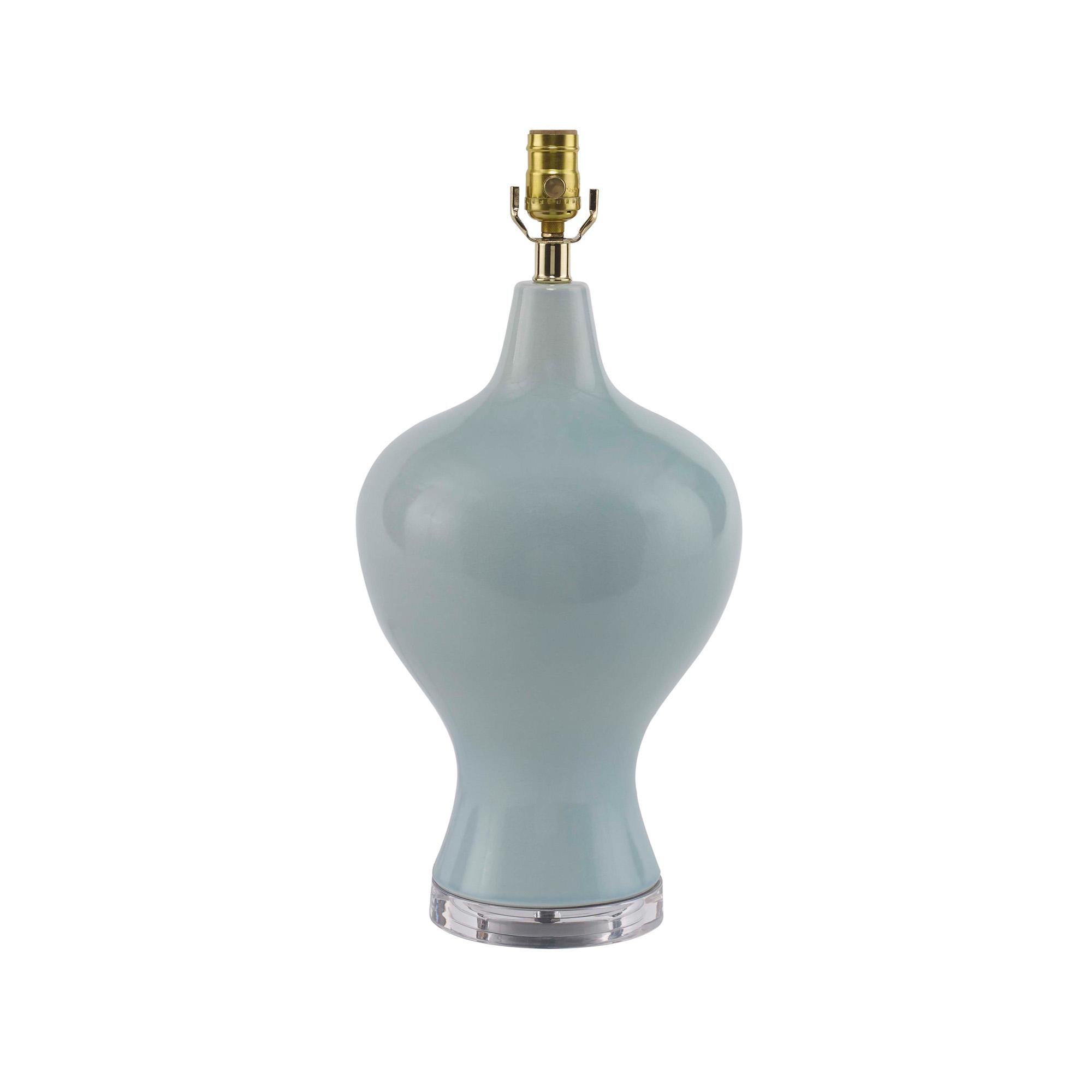 From the Jan Showers for Kravet lighting collection. A ceramic body with acrylic base, topped with a linen lampshade. Features a clear crystal ball finial.
 