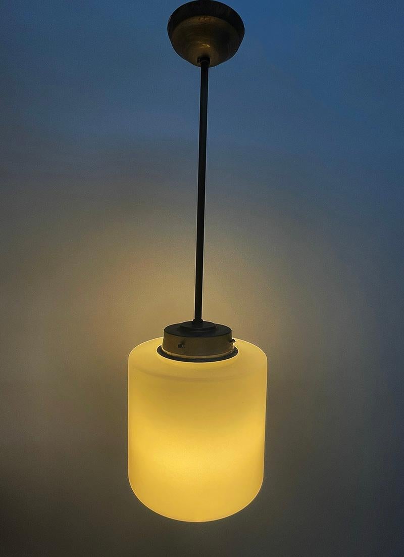 Giso Art Deco pendant lamp by W.H. Gispen, 1930s

An Art Deco pendant lamp with a white glass shade with a total length of approximately 80 cm, by W.H. Gispen, the Giso collection. 
The Netherlands, 1930s. The rod is approximately 55 cm long and