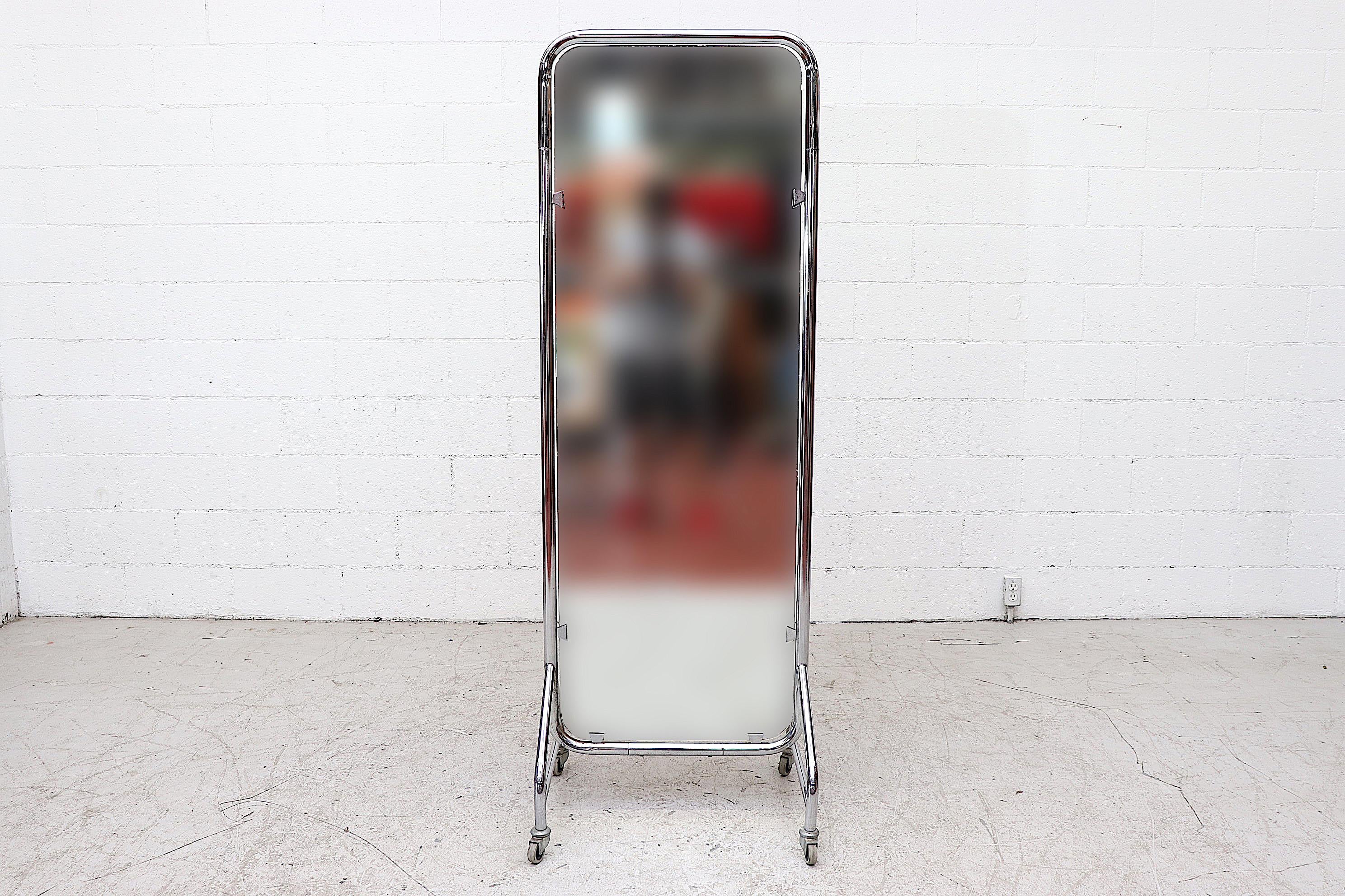 Rare midcentury Gispen full length rolling hospital mirror with chrome frame. In original condition with visible wear consistent with its age and usage.