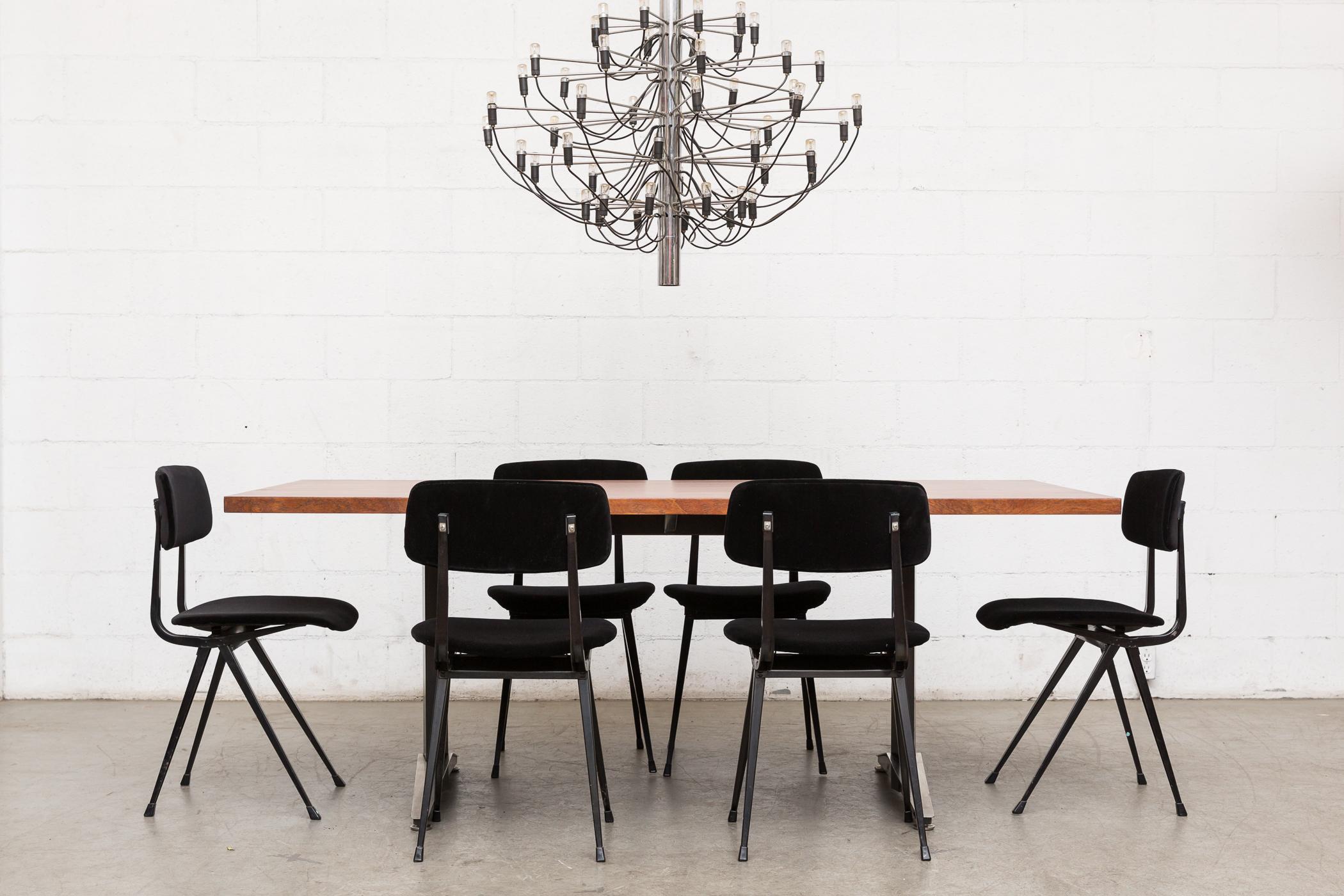 Impressive combination of wood, chrome, and enameled sheet metal. Beautiful mahogany top. Black enameled steel frame with brushed steel accents. Gorgeous desk, dining or conference table by Gispen. Frame in original condition with visible wear
