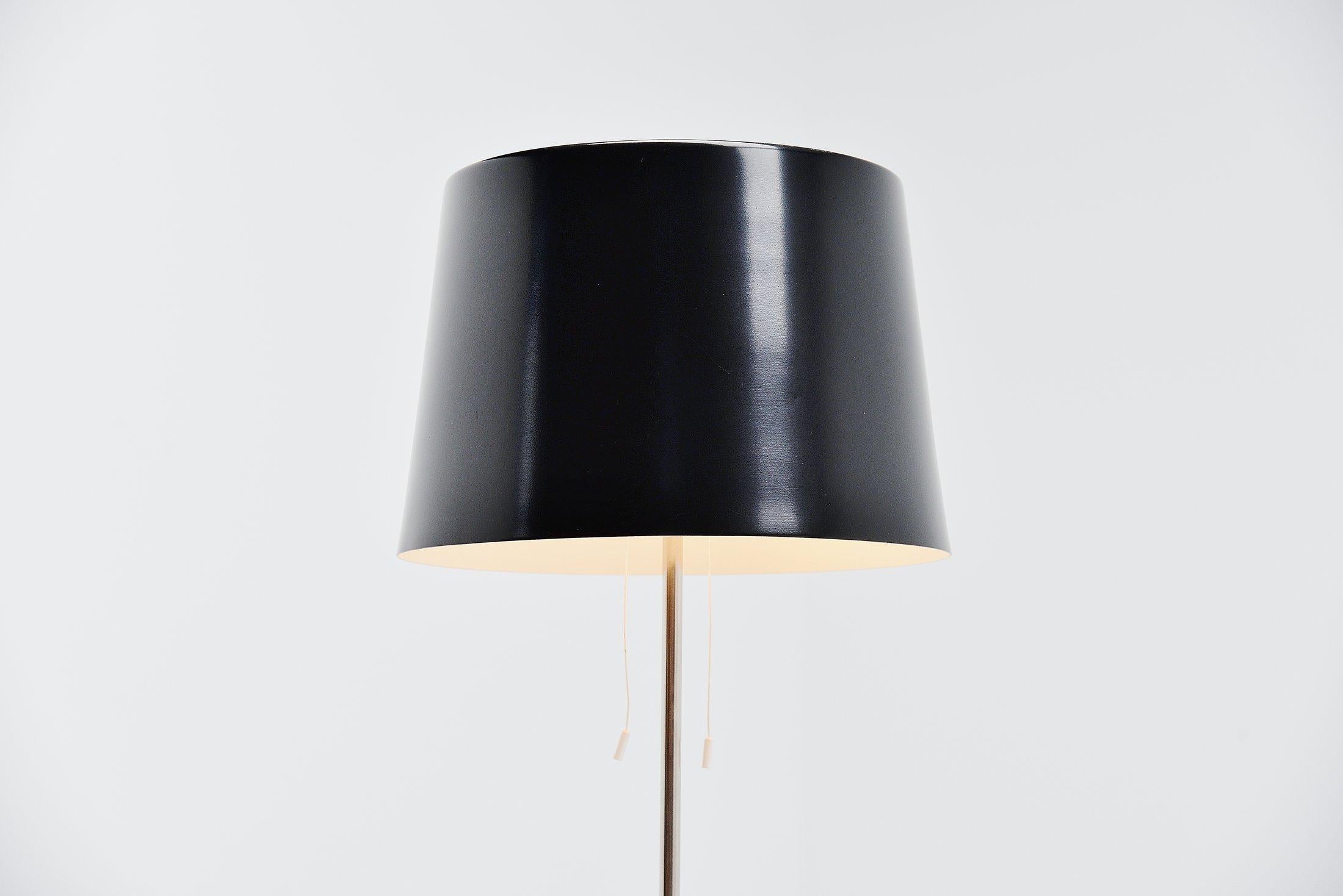Very nice floor lamp by Gispen. This lamp has an original black lacquered weighted base and a chromed arm. The shade is refinished in original black color and looks amazing. It can be lit separate up and down.

All our lights are checked, cleaned