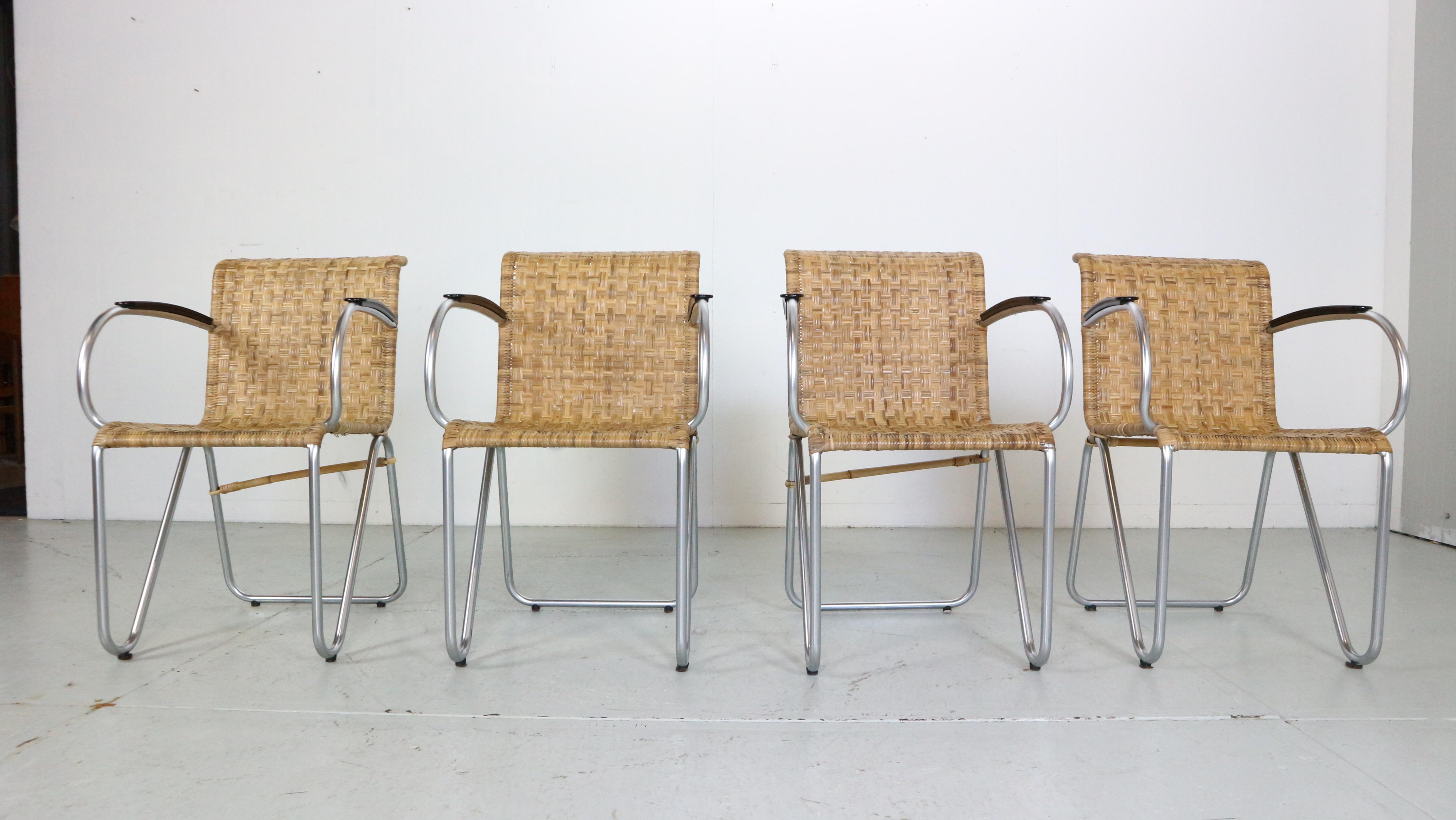 Mid- Century modern period, vintage set of 4 armchairs designed by Willem H. Gispen for Gispen in 1930's.

102 Diagonal tube chairs
The chairs are made of woven wicker rattan seats and tubular steel chrome frames.
 The set is in a good vintage