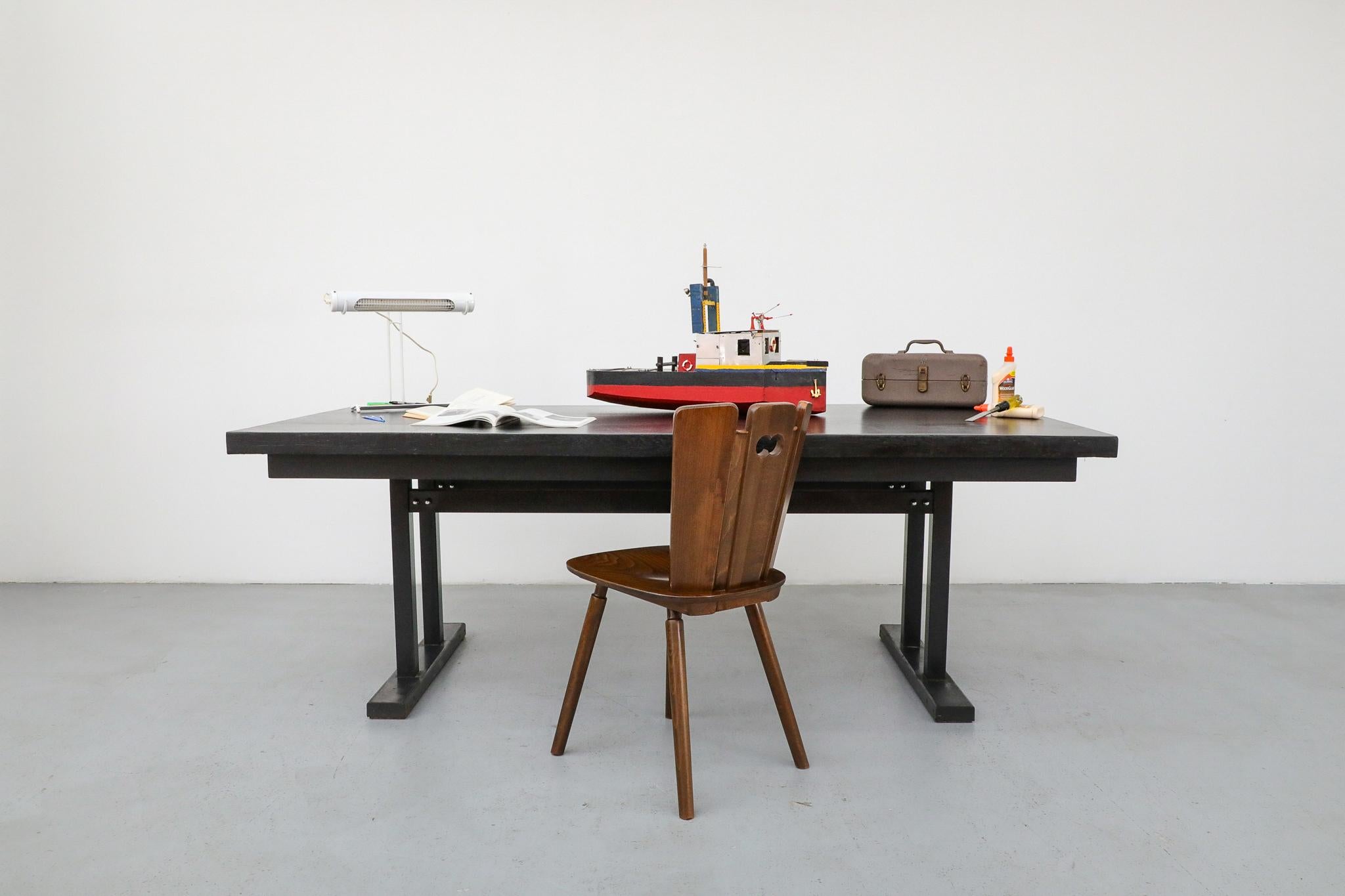 Massive Mid-Century conference, dining, or work table in the style of Gispen, manufactured by Tijsseling Meubelfabrieken in the Netherlands, likely in the 1960s or early 1970s. Tijsseling, a Dutch maker active during the Mid-Century period, was