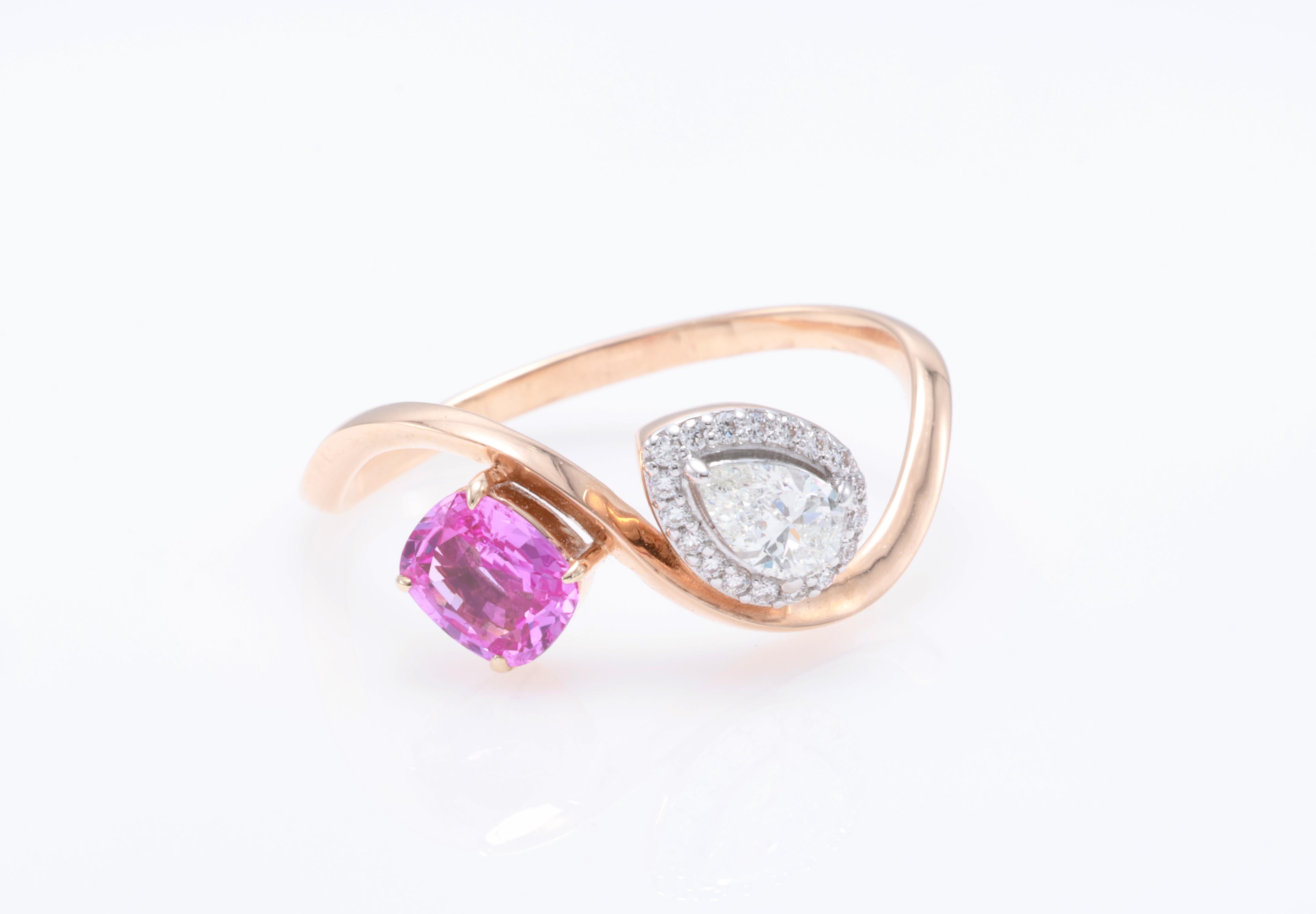 18kt white gold sapphire ring with diamonds
  
  Gold colour & karat: White gold 18kt
  Weight: 2.302 grams
  
  Set with-
  Stone type: Sapphire
  Shape: Cushion
  Carat: 0.53 
  Colour: Pink
  Clarity: -
  
  Surrounding Stones: Diamonds
 1) Side