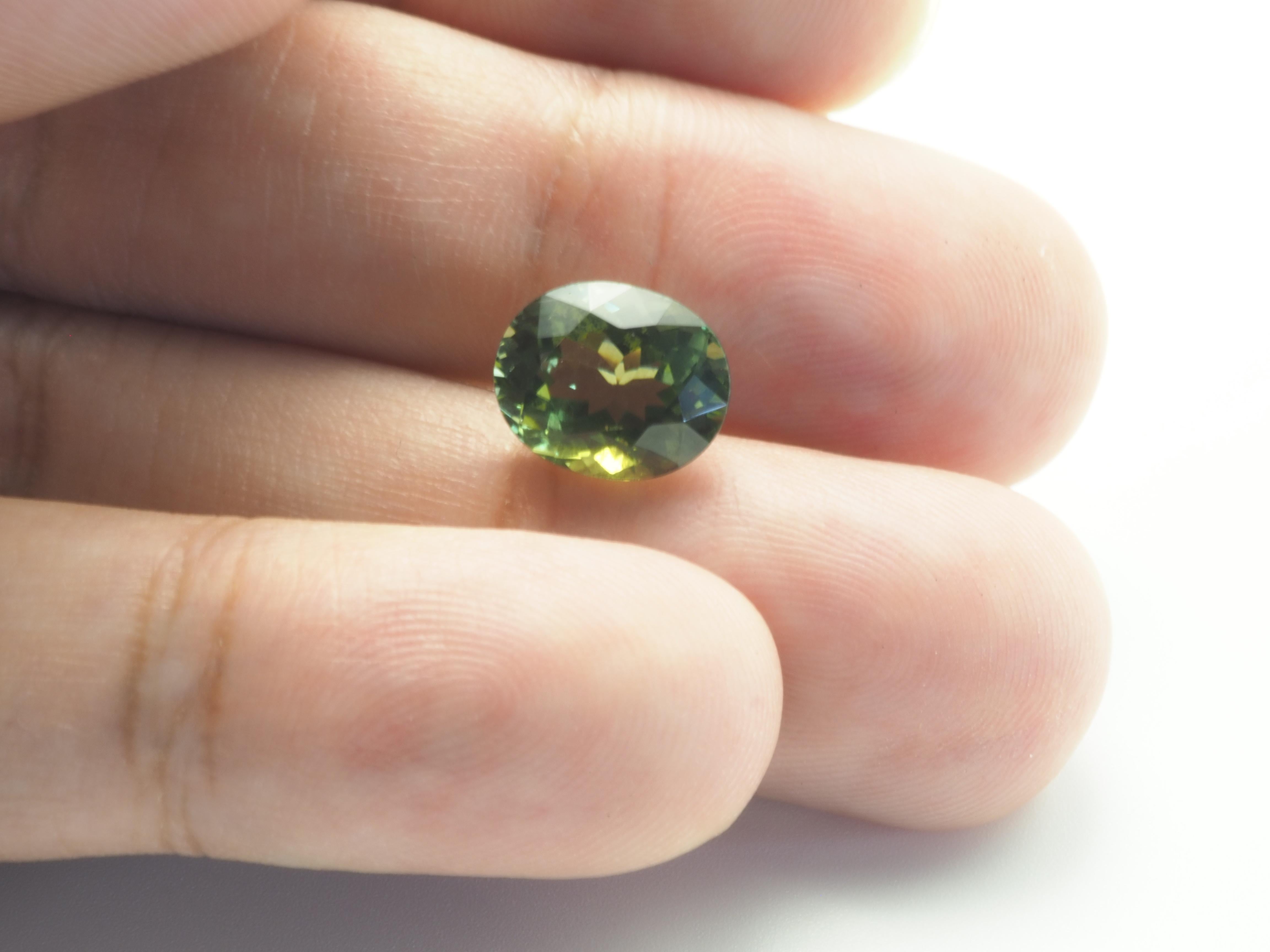 GIT Certified 4.37ct Oval Olive Green Tourmaline, Eye Clean, 11.13x9.12x6.59 mm For Sale 3
