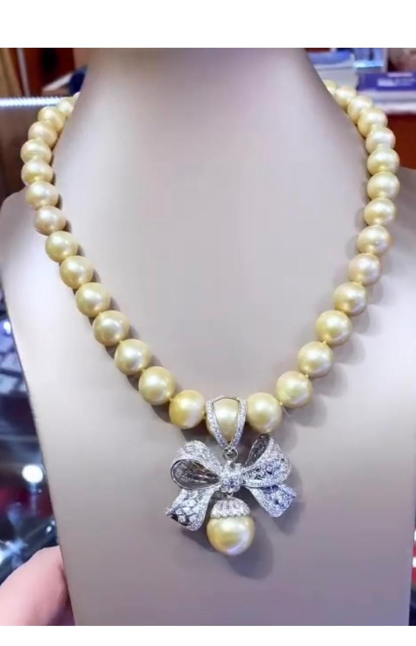 Unique Golden South Sea Pearls pendant necklace. A very collector piece . An Golden Pearls necklace exudes an air of elegance and sophistication, depicting unparalleled  craftsmanship. It features beautifully crafted flake made of white diamonds,