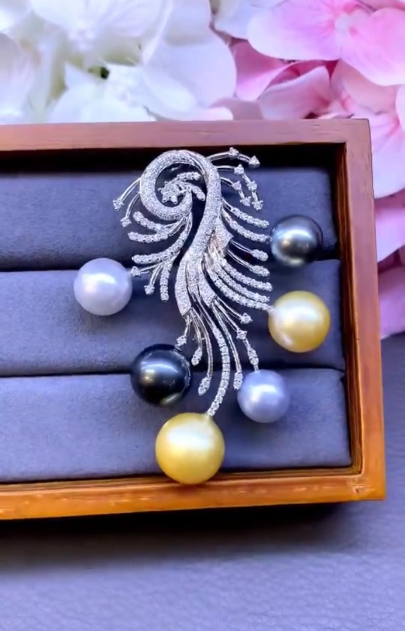An exquisite Golden, White South Sea Pearls ,Tahitian Pearls and Diamonds brooch/pendant.
This brooch/pendant feature lustrous pearls that possess a radiant glow, symbolizing luxury and opulence .
The pearls are carefully set in a intricate design
