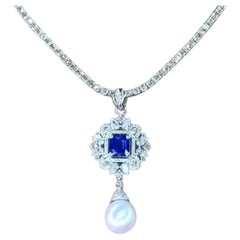 Pendentif perle des mers du Sud certifiée GIT, saphir de Ceylan 3,60 carats et diamants 3,40 carats