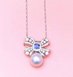 Blue Sapphire & South Sea Pearl & Diamond Bow Pendant in 18K Gold
