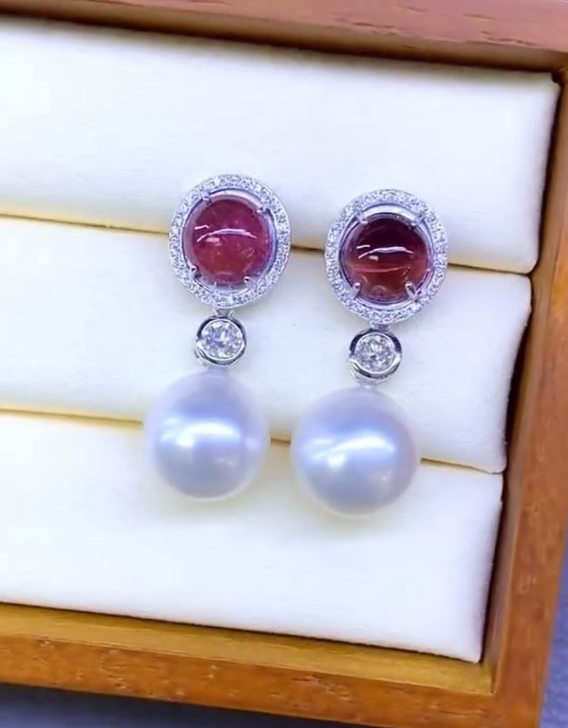 An exclusive white South Sea Pearls, Tourmaline and Diamonds pair of earrings.
Impressive and elegant contemporary design.
Adds a touch of class and glamour on your look, and worn  a perfect match.
Stunning earrings come in 18k gold with 2 pieces of