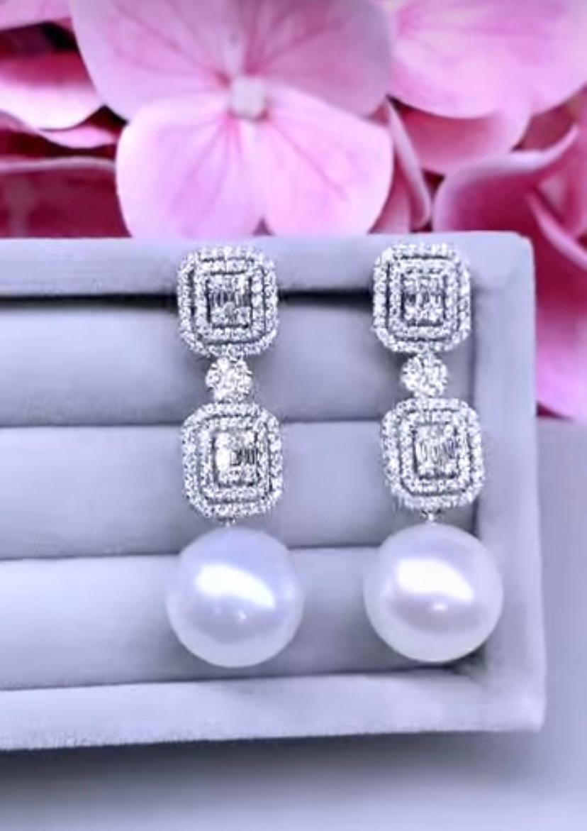 An exquisite South Sea Pearls and Diamonds earrings.
White South Sea Pearls are highly prized for their exquisite beauty and elegance. Their lustrous and creamy appearance adds a touch of sophistication to any jewelry piece, making them perfect for