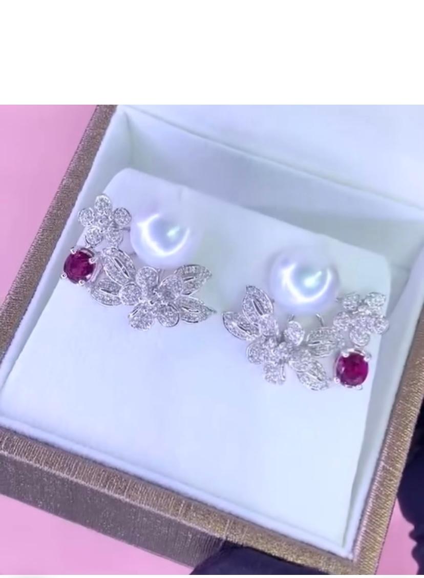 An exquisite South Sea Pearls, Diamonds and Rubies earrings, in a classic and original design.
Elevate your timeless of beauty and add a touch of charm and sophistication on your look.
Stunning earrings come in 18k gold with a lustrous South Sea