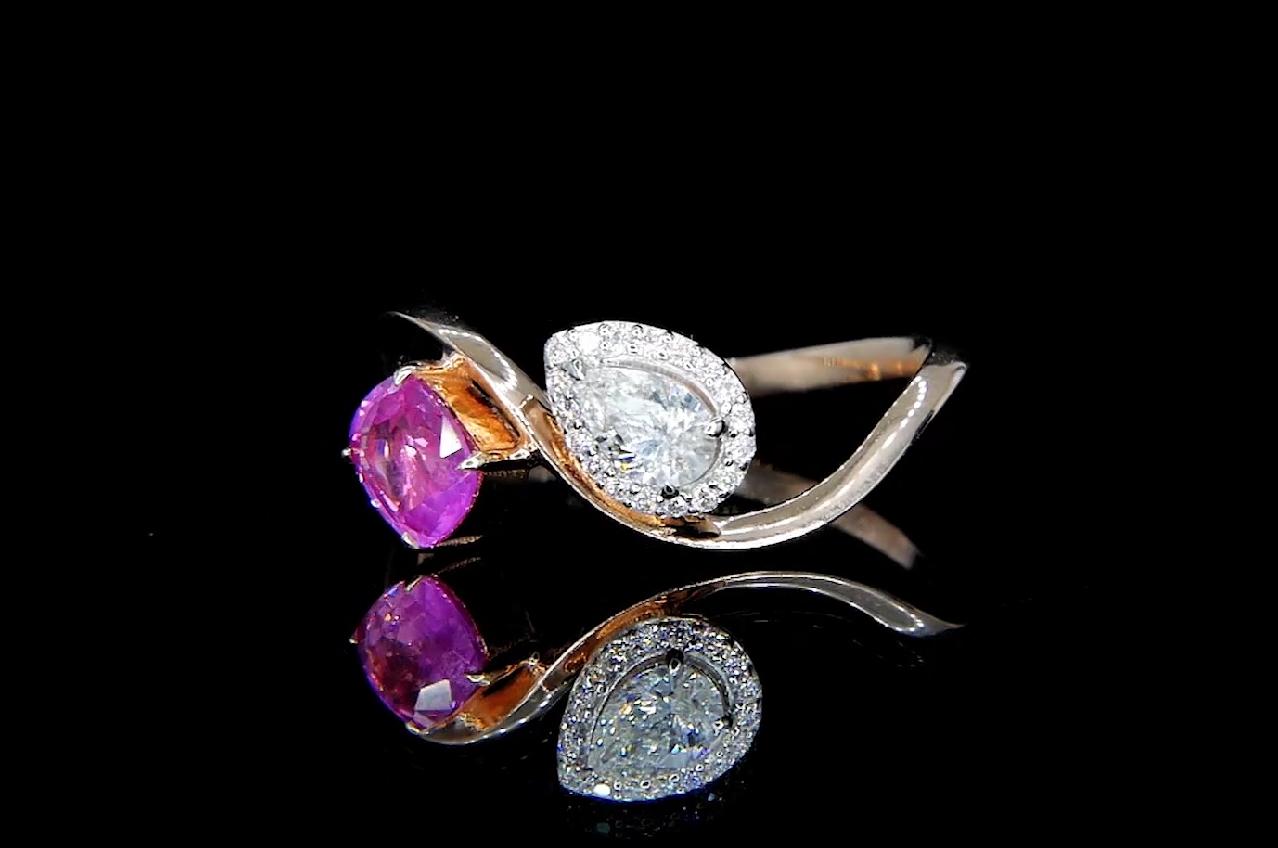 18kt white gold sapphire ring with diamonds
  
  Gold colour & karat: White gold 18kt
  Weight: 2.375 grams
  
  Set with-
  Stone type: Sapphire
  Shape: Cushion
  Carat: 0.68 
  Colour: Pink
  Clarity: -
  
  Surrounding Stones: Diamonds
 1) Side