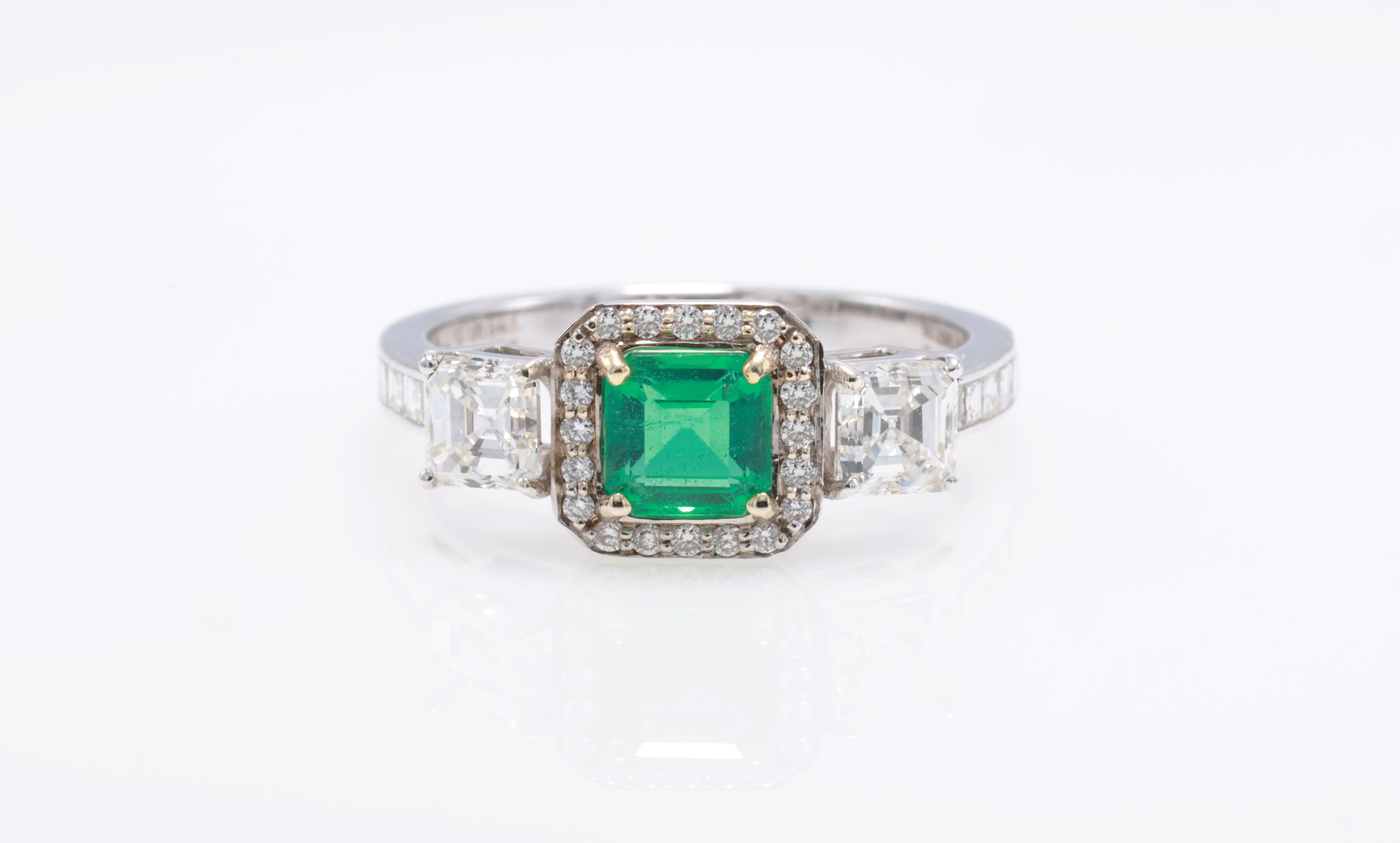 18kt white gold ring with diamonds
  
  Gold colour & karat: White gold 18kt
  Weight: 3.438 grams
  
  Set with-
  Stone type: Diamond
  Shape: Octagon
  Carat: 0.63 
  Colour: Green
  Clarity: -
  
  Surrounding Stones: Diamonds
 1) Side Ascher