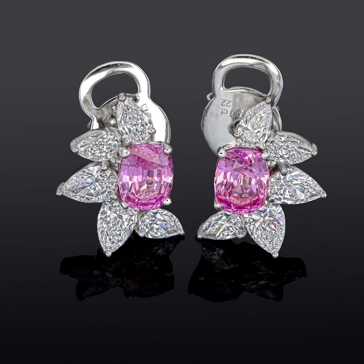 18kt white gold earring with diamonds
  
  Gold colour & karat: White gold 18kt
  Weight: 2.850 grams
  
  Set with-
  Stone type: Sapphire
  Shape:  Oval - Cushion
  Carat: 1.03 ct (02 Pcs) 
  Colour: Pink
  Clarity: -
  
  Surrounding Stones:
