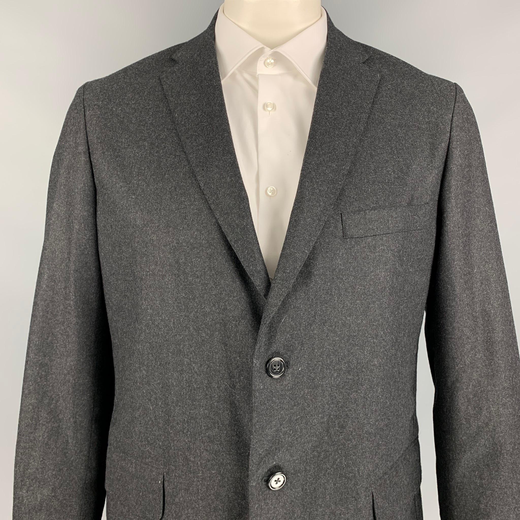 GITMAN BROS for UNIONMADE sport coat comes in a charcoal wool with a half liner featuring a notch lapel, flap pockets, double back vent, and a double button closure. Made in USA. 

New With Tags. 
Marked: 44
Original Retail Price: