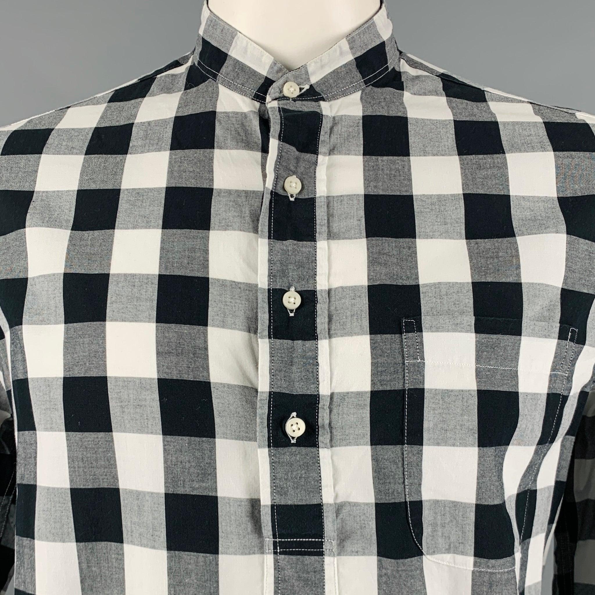 GITMAN VINTAGE long sleeve shirt
in a
black and white cotton fabric featuring a tunic style, buffalo plaid pattern, and half placket button closure. Made in USA.Excellent Pre-Owned Condition. 

Marked:   L 

Measurements: 
 
Shoulder: 17 inches