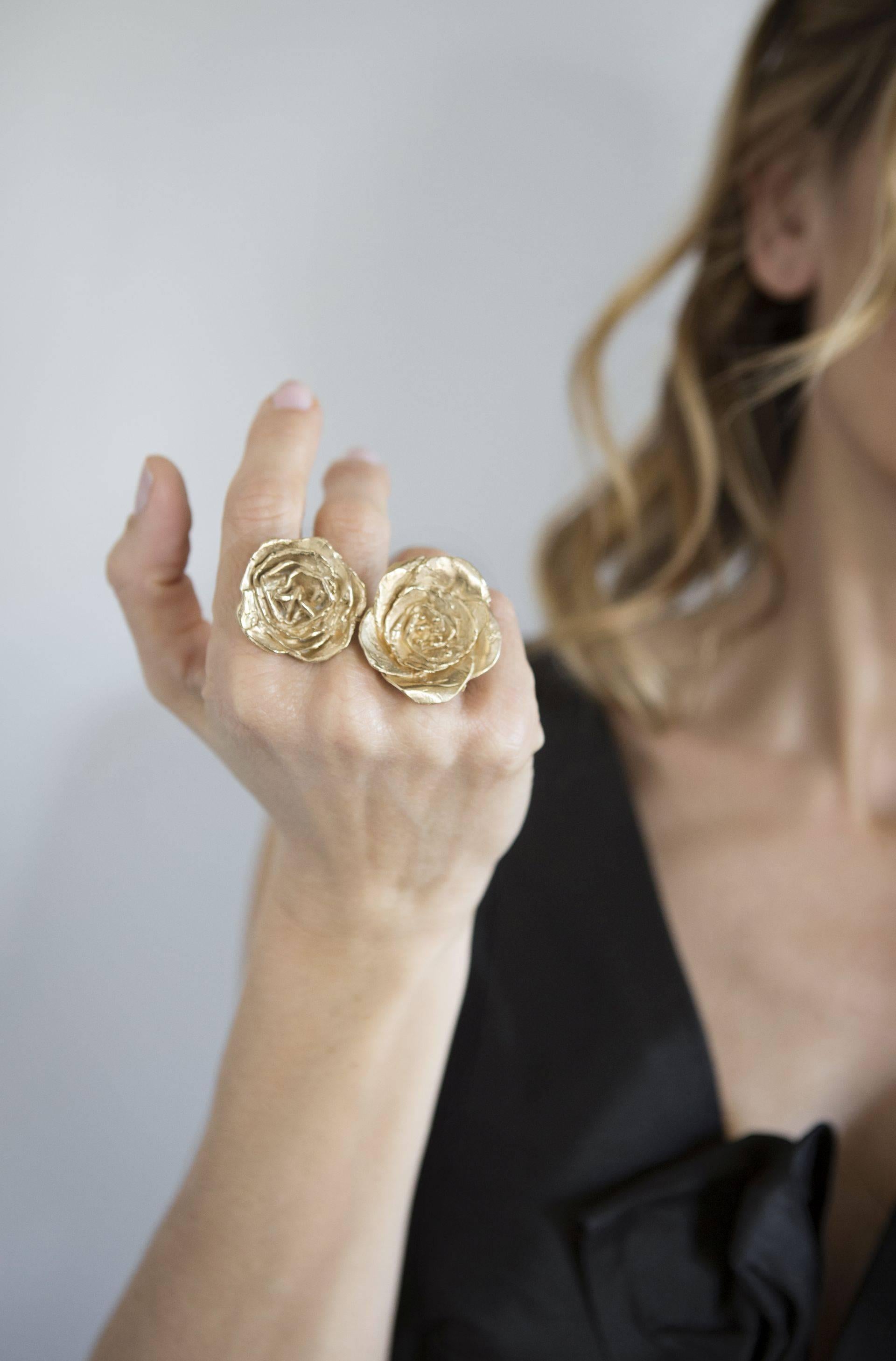 Giulia Barela's Cameliae ring is handmade and dipped in 24k gold plated bronze.

Completely inspired by nature, in particularly light this jewel is brought to life. Giulia Barela jewels are characterized, stylistically, from strong sculptural