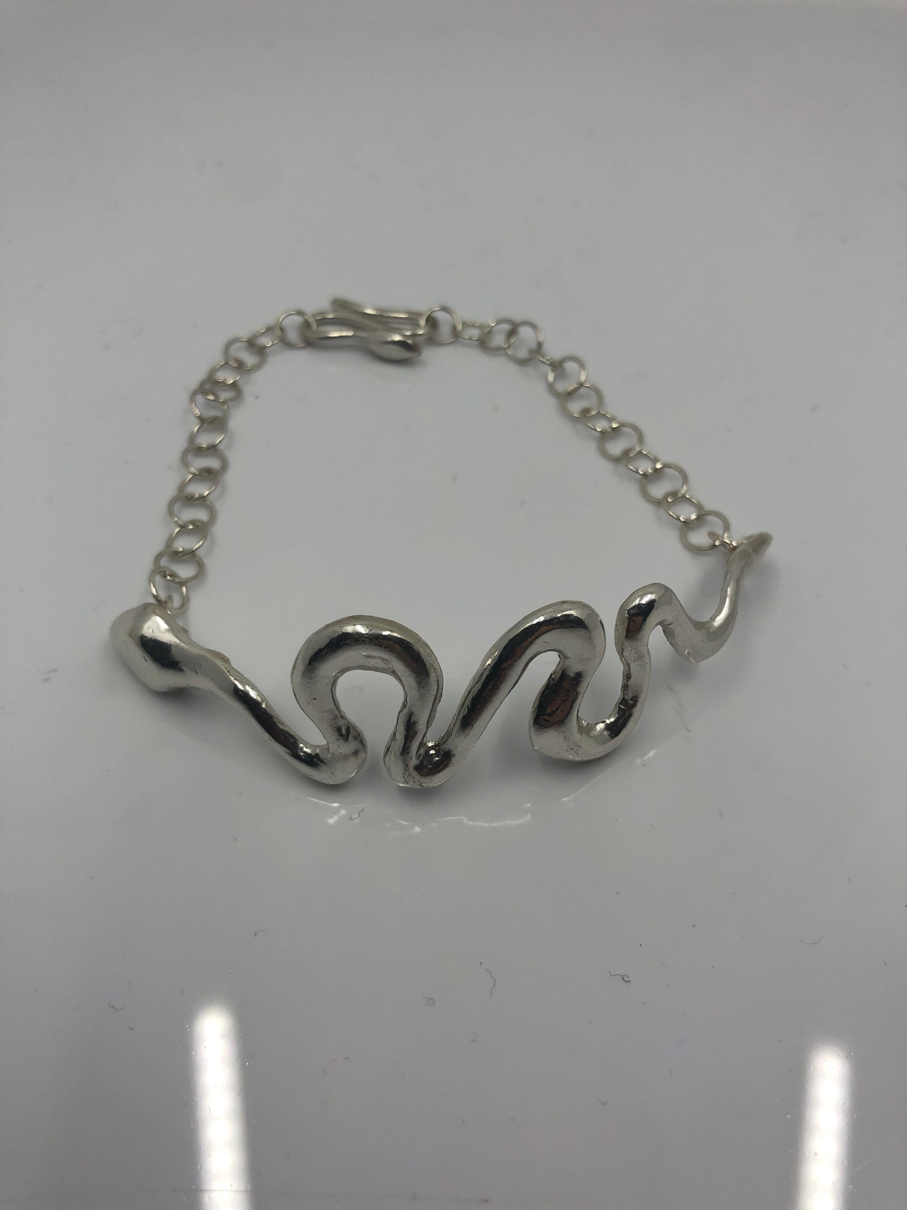 Giulia Barela’s Ribbon bracelet

A small snake wraps around a wrist sinuously, comforting and protective.

Materials: 925 silver 
Weight: 18,3 gr
Lenght: 19 cm clasp included, adjustable. 