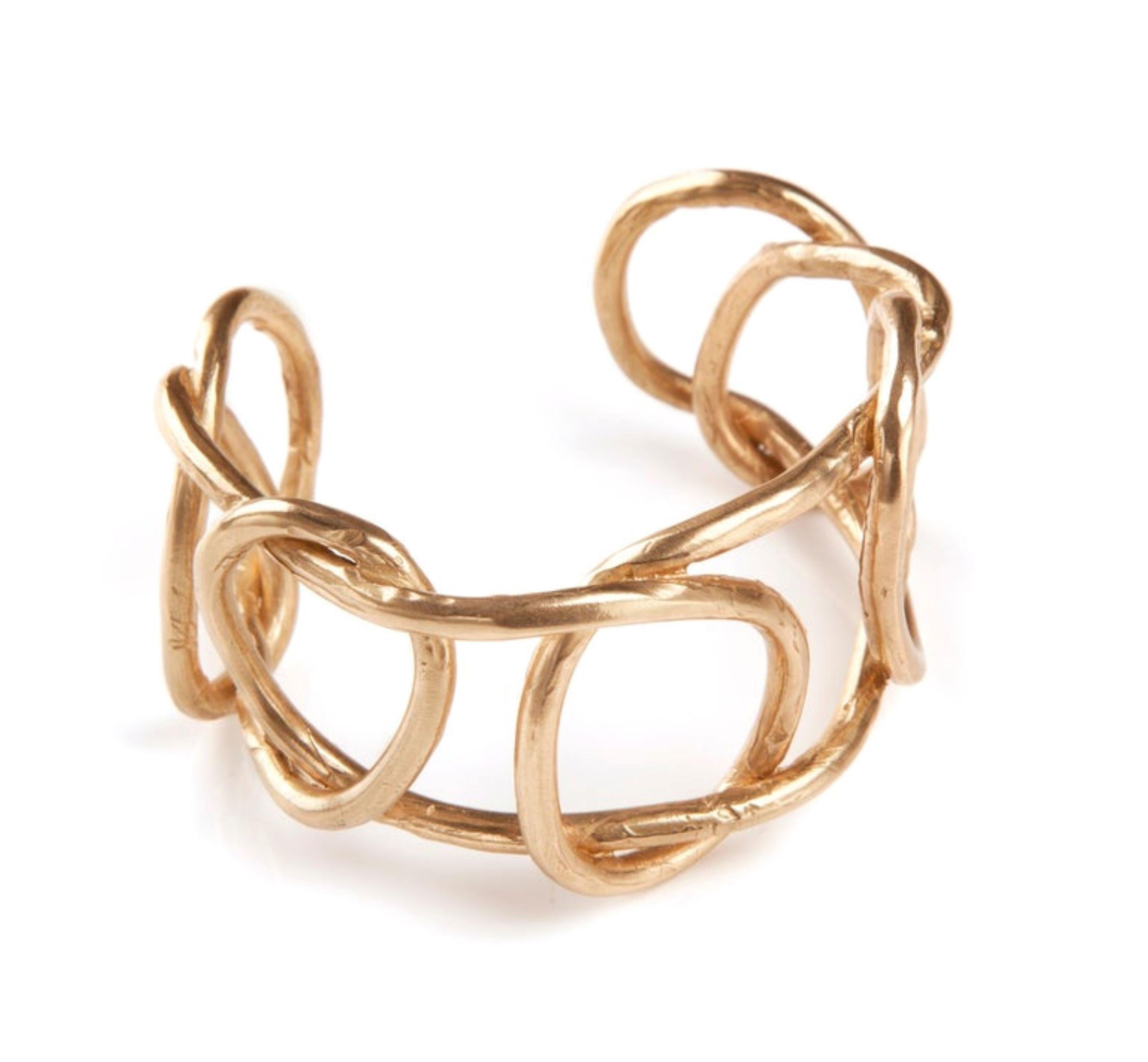 Giulia Barela Jewelry is handmade in the heart of Rome, Italy by master goldsmiths. Giulia Barela designs her jewelry by studying volumes and sizes to demonstrate the natural beauty of simple things. 
This cuff bracelet is bronze dipped in 24 karat