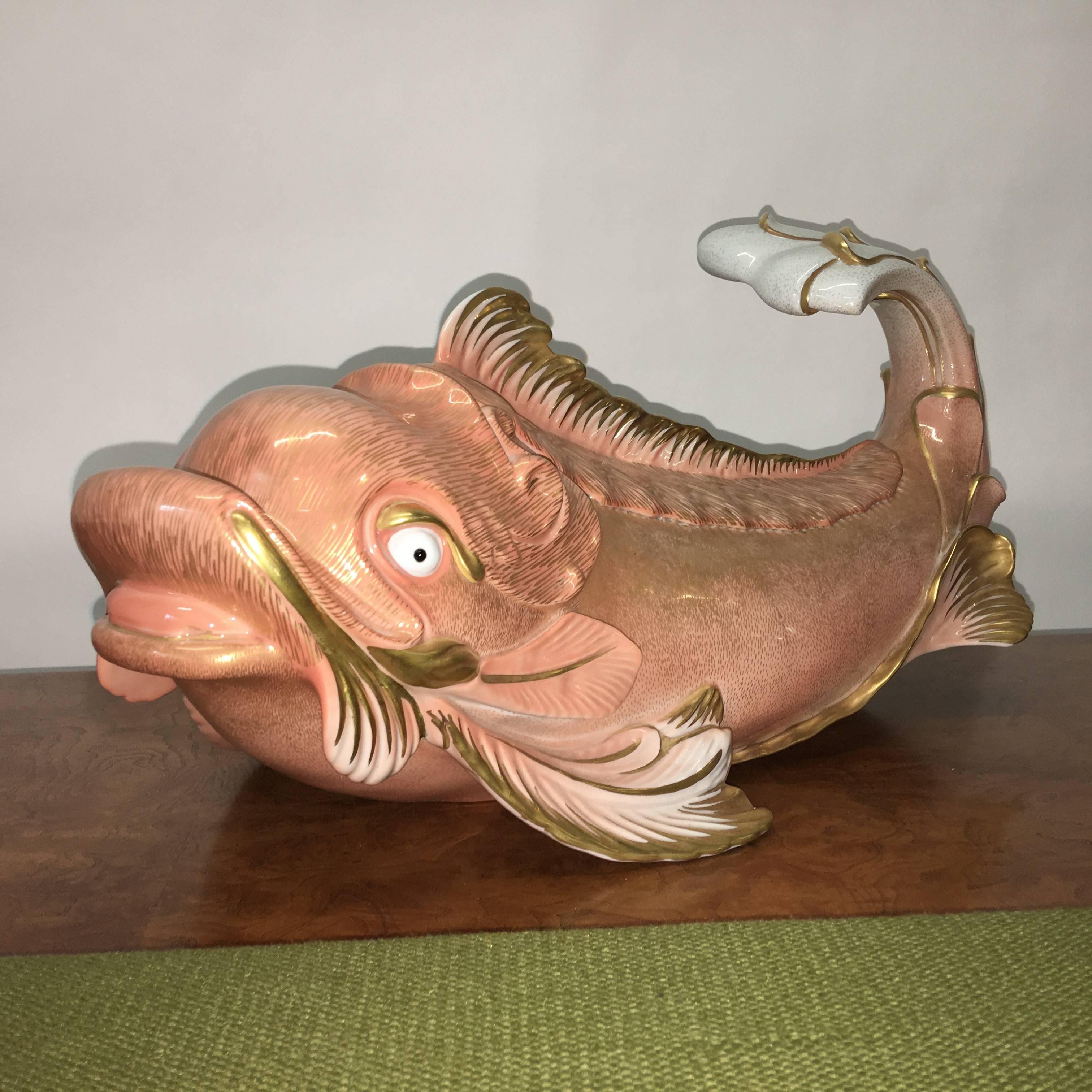 Giulia Mangani for Oggetti Italy grand scale porcelain and stylized dolphin or porpoise, hand-painted and 24-karat gilt.

Color is a pale coral peachy melon on white with gold accents. 

Original labels present.

Produced in 1970s.


 