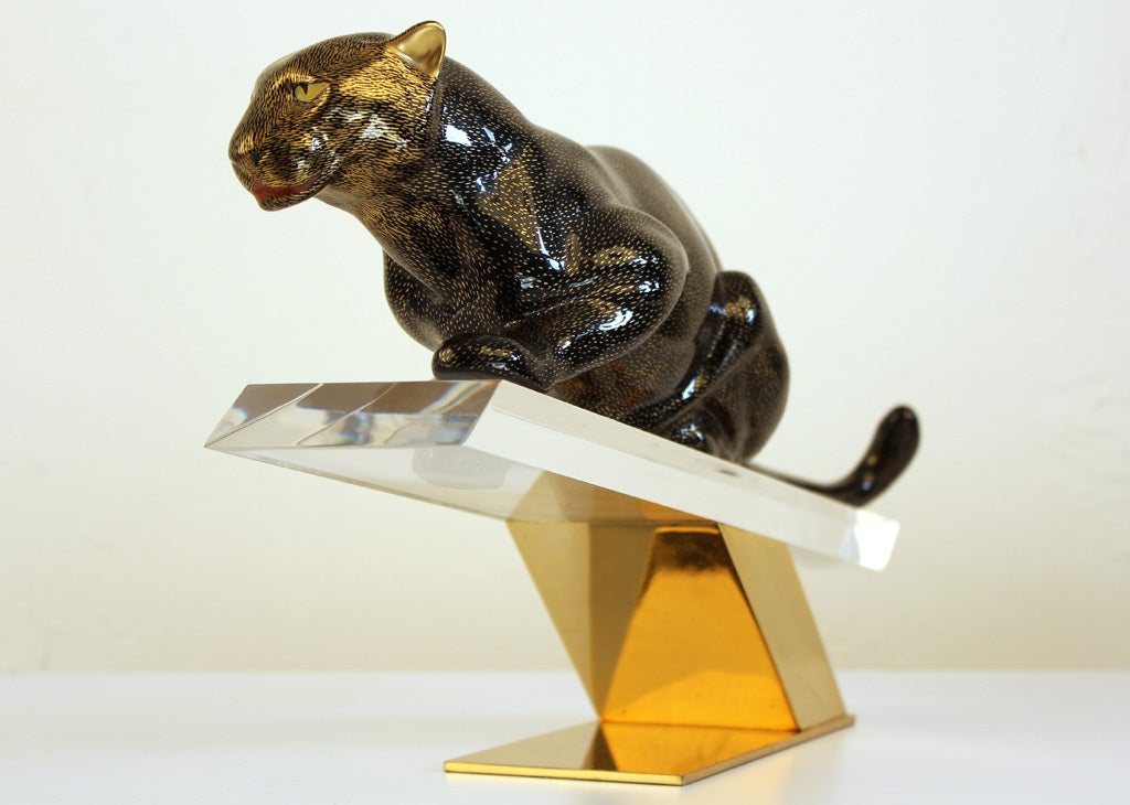 Stunning Giulia Mangani porcelain panther sculpture on a Lucite and brass base for Oggetti. Made in Italy and still has the original tags under the base. The porcelain panther has hand painted details and accents. Stunning at every angle. In very