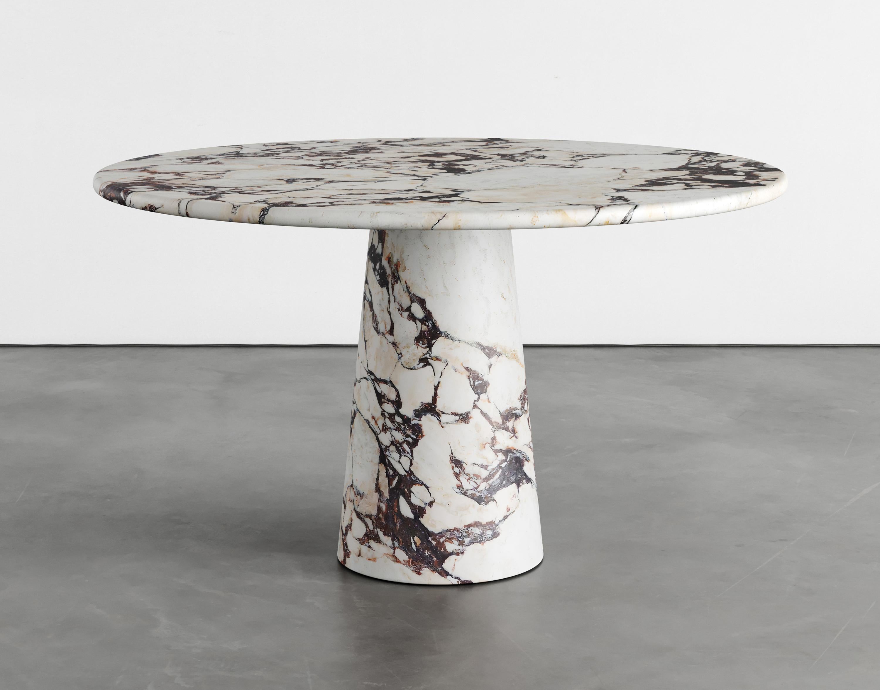 Giulia marble dining table by Agglomerati
Dimensions: D 130 x H 75 cm
Materials: Calacatta Viola marble
Available in other stones.

Giulia Dining Table has a refined, splayed central column. Its simplistic form allows the texture of the stone
